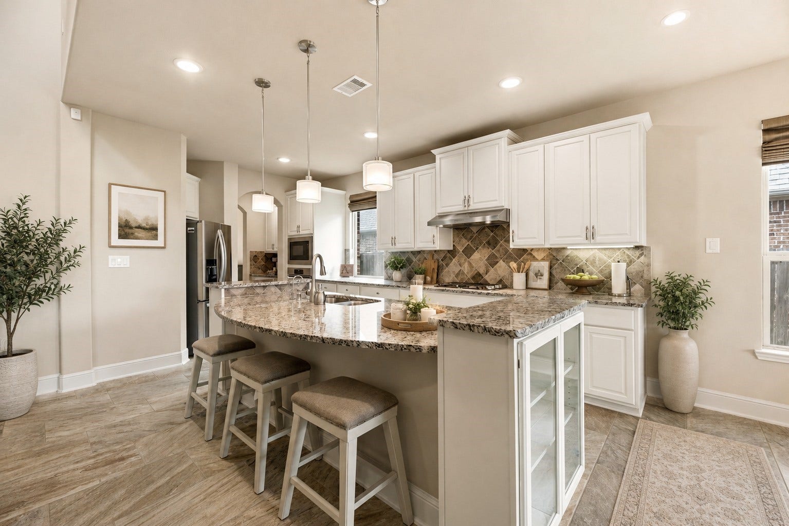 22826 Burton Grove Road, Richmond, TX 77469 The island can serve as a breakfast bar and offers glass doored cabinets at both ends. The French door refrigerator will stay. (virtually staged)