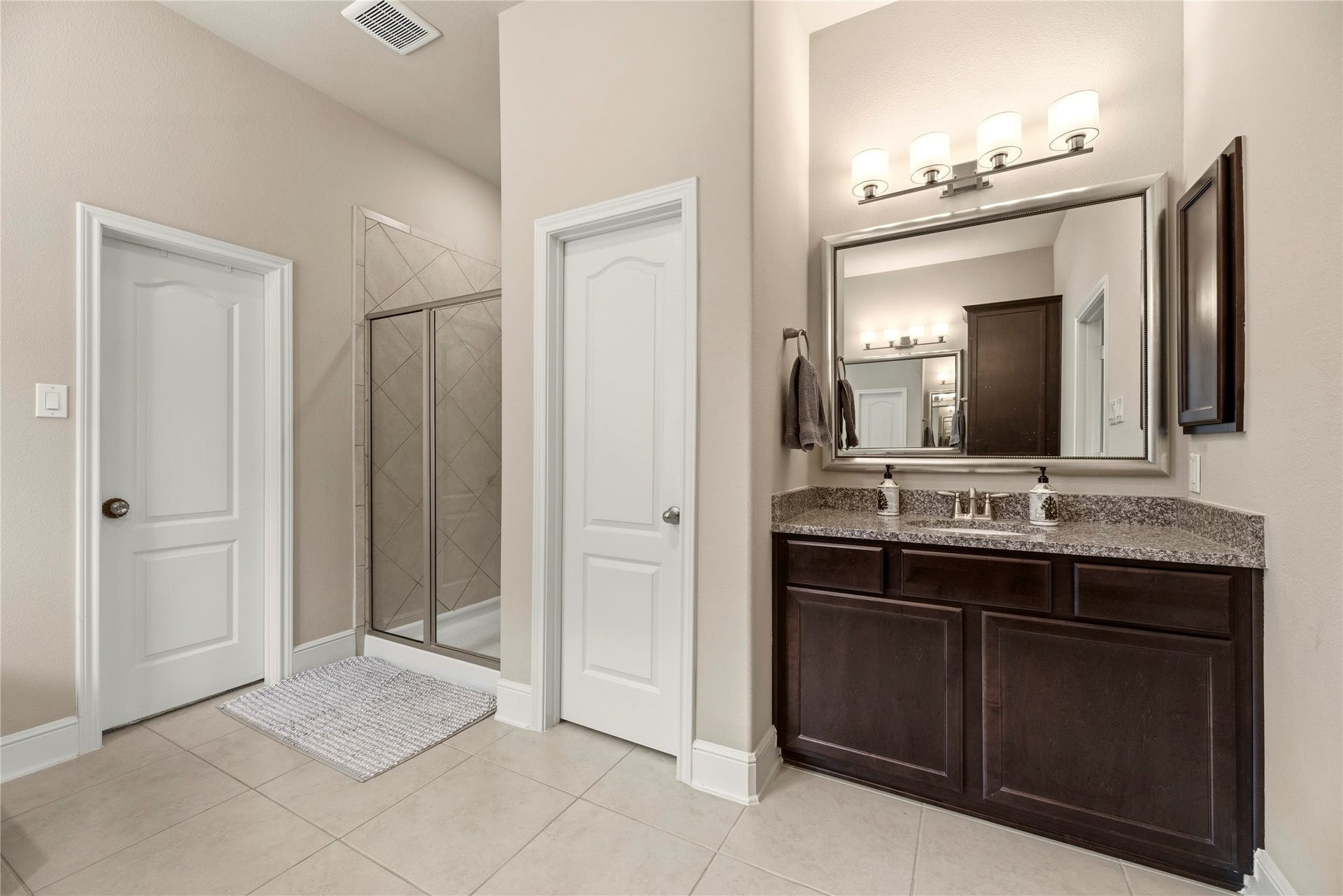 22826 Burton Grove Road, Richmond, TX 77469 Opposite view of the primary bath. The door on the left of this photo opens into the walk-in closet.