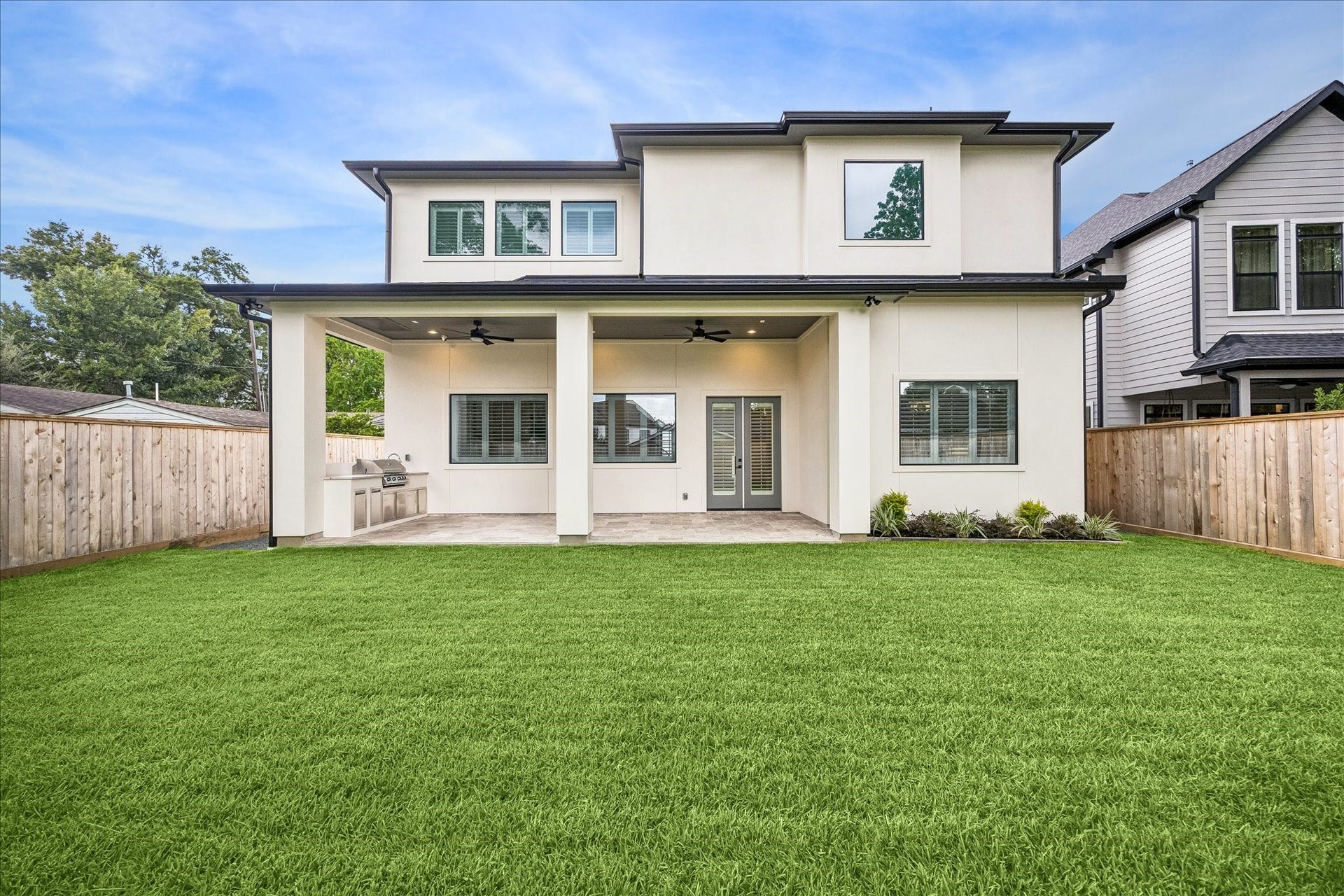 Generous fenced backyard offers plenty of open lawn for play, pets or future outdoor enhancements, complemented by a deep covered patio for year round enjoyment.