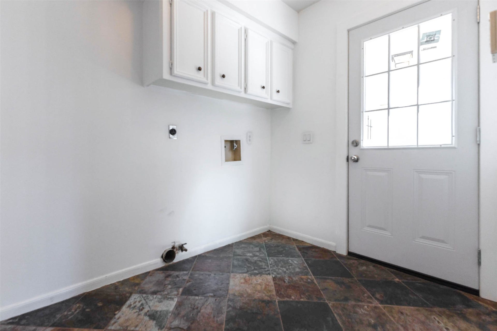 Laundry Room w/washer dryer connections & space for secondary refrigerator