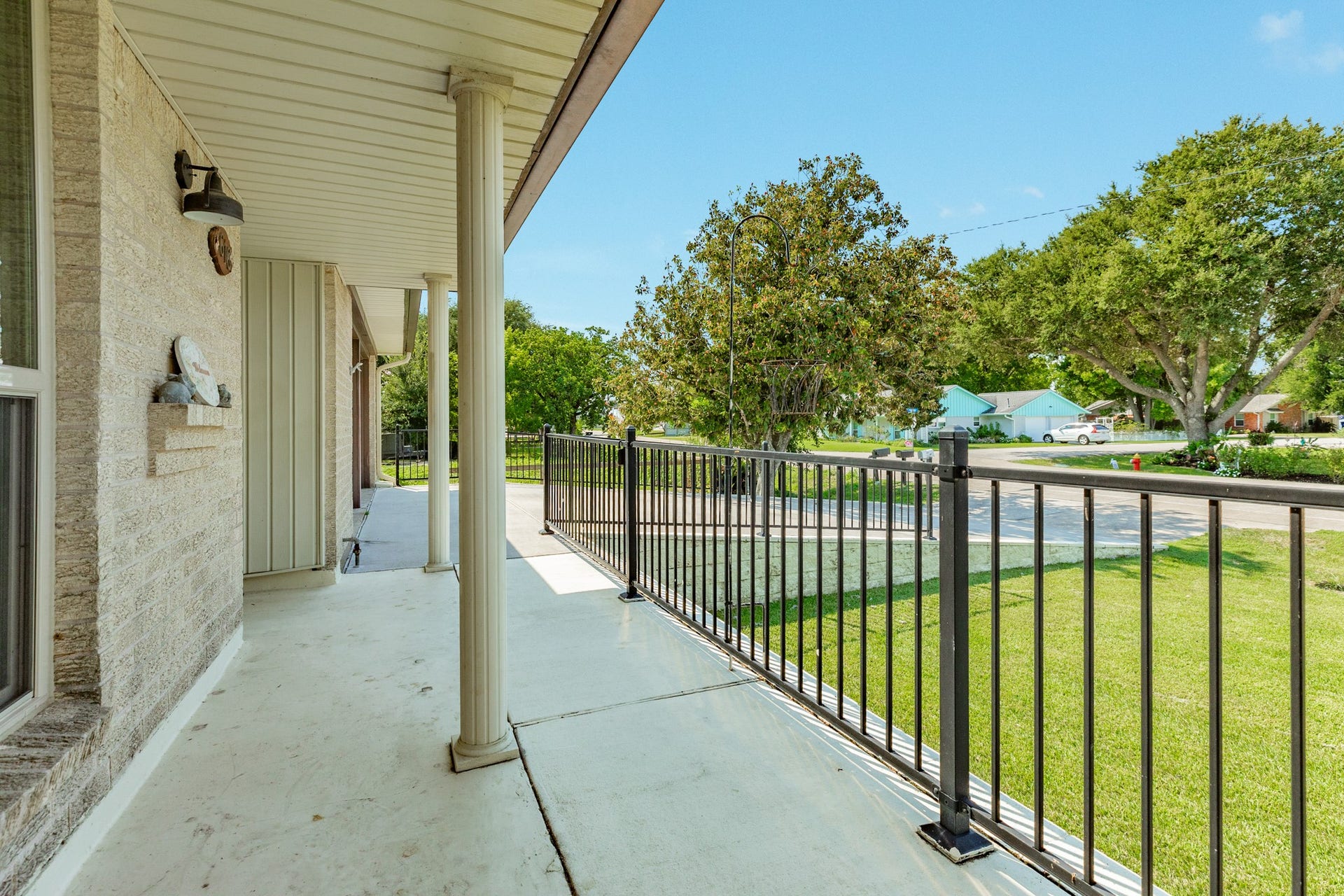 The generous covered entry provides a welcoming approach to the home and features a decorative glass front door.