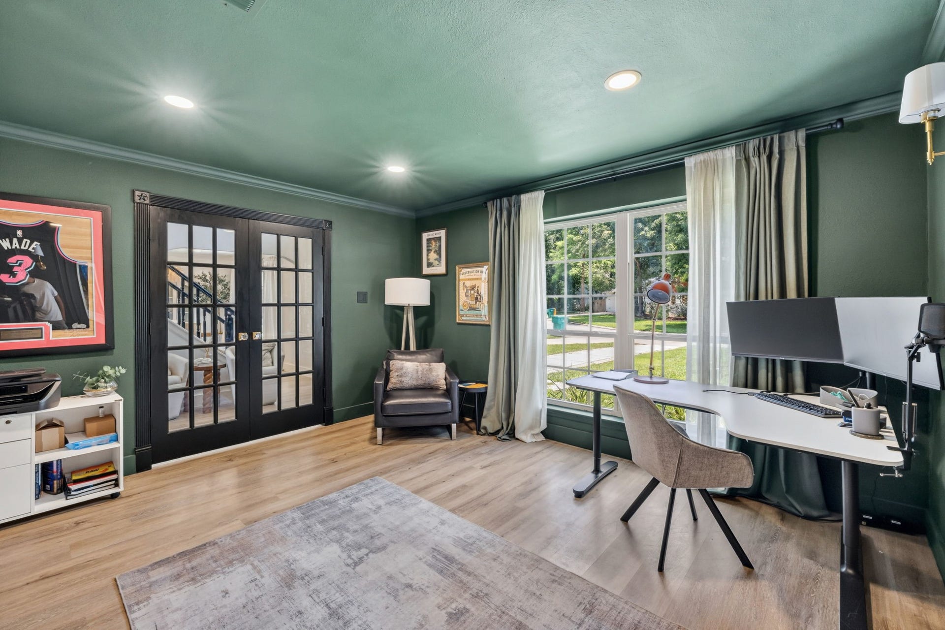 129 N Rainbow Ridge Circle, The Woodlands, TX 77381 Striking black doors add contrast and character to the space