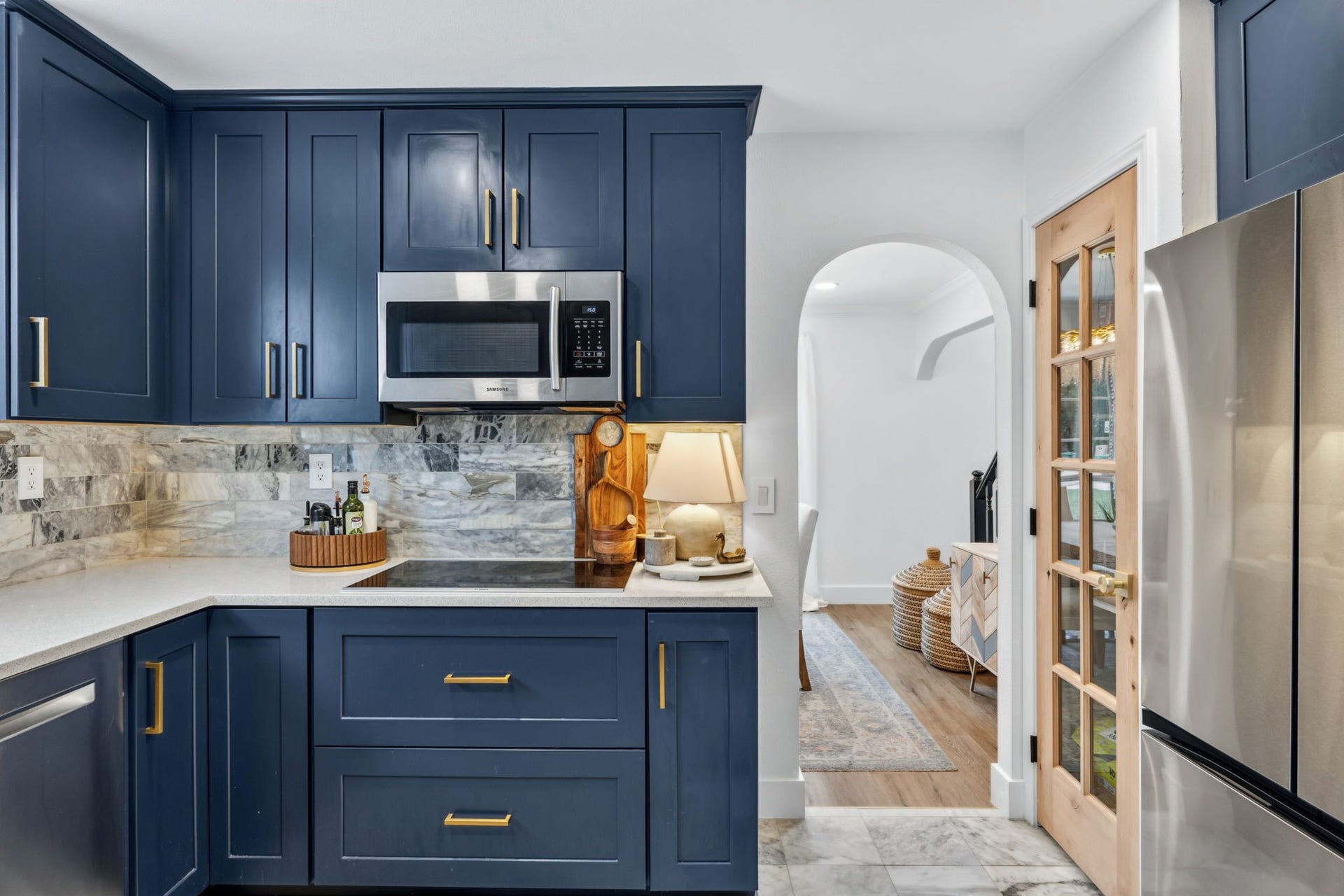129 N Rainbow Ridge Circle, The Woodlands, TX 77381 Thoughtfully updated with an induction cooktop, generous storage, and seamless flow
