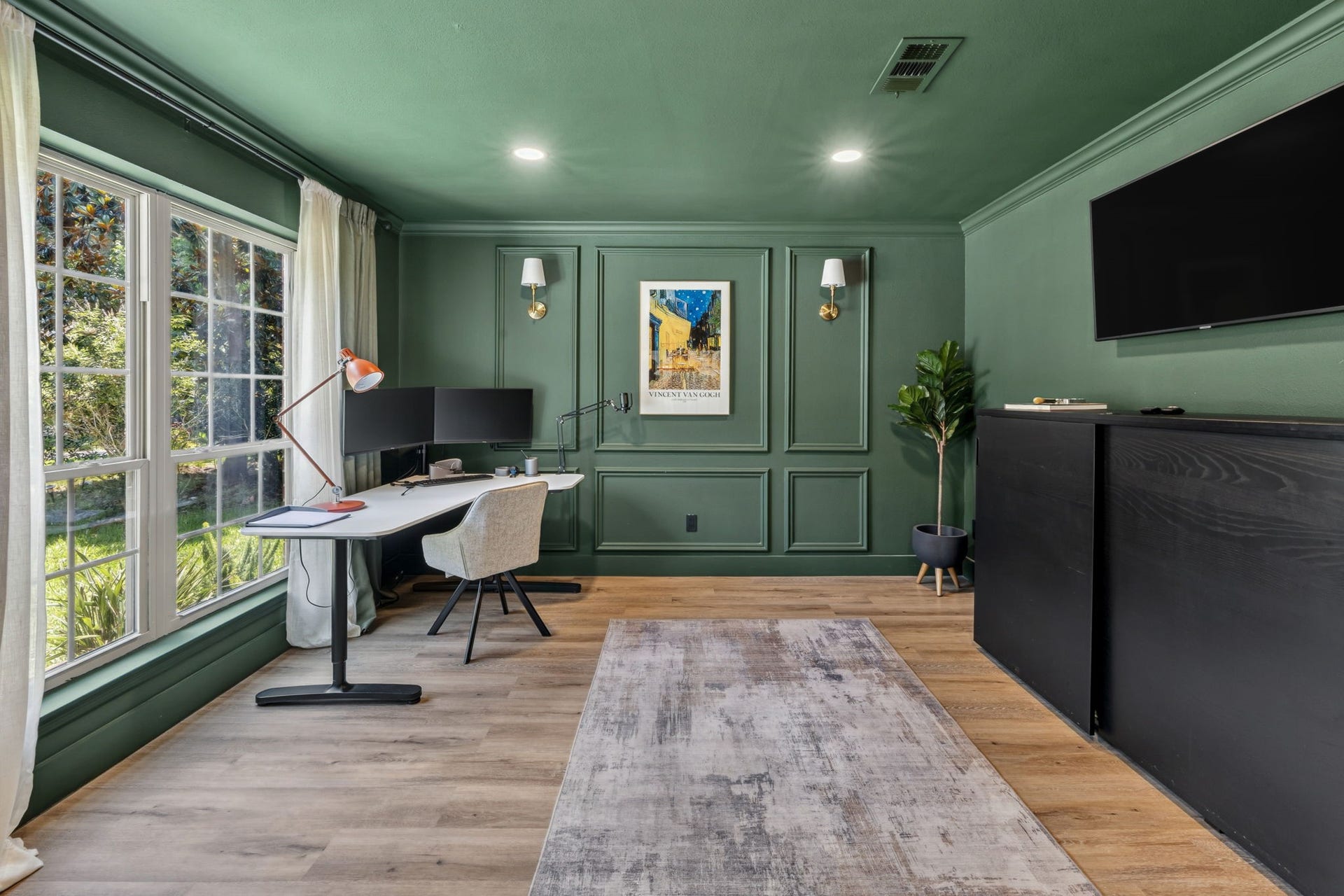 129 N Rainbow Ridge Circle, The Woodlands, TX 77381 A moody green office designed to inspire focus, creativity, and calm