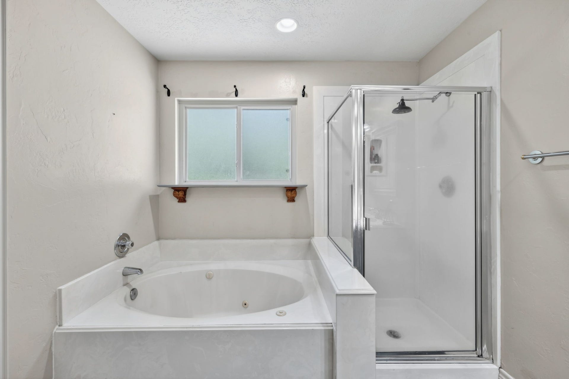 129 N Rainbow Ridge Circle, The Woodlands, TX 77381 End the day with a jetted-soaking tub, walk-in shower