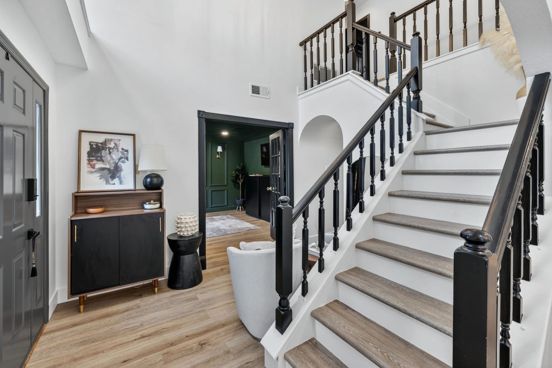 129 N Rainbow Ridge Circle, The Woodlands, TX 77381 From the staircase to the office beyond, every angle feels thoughtfully curated