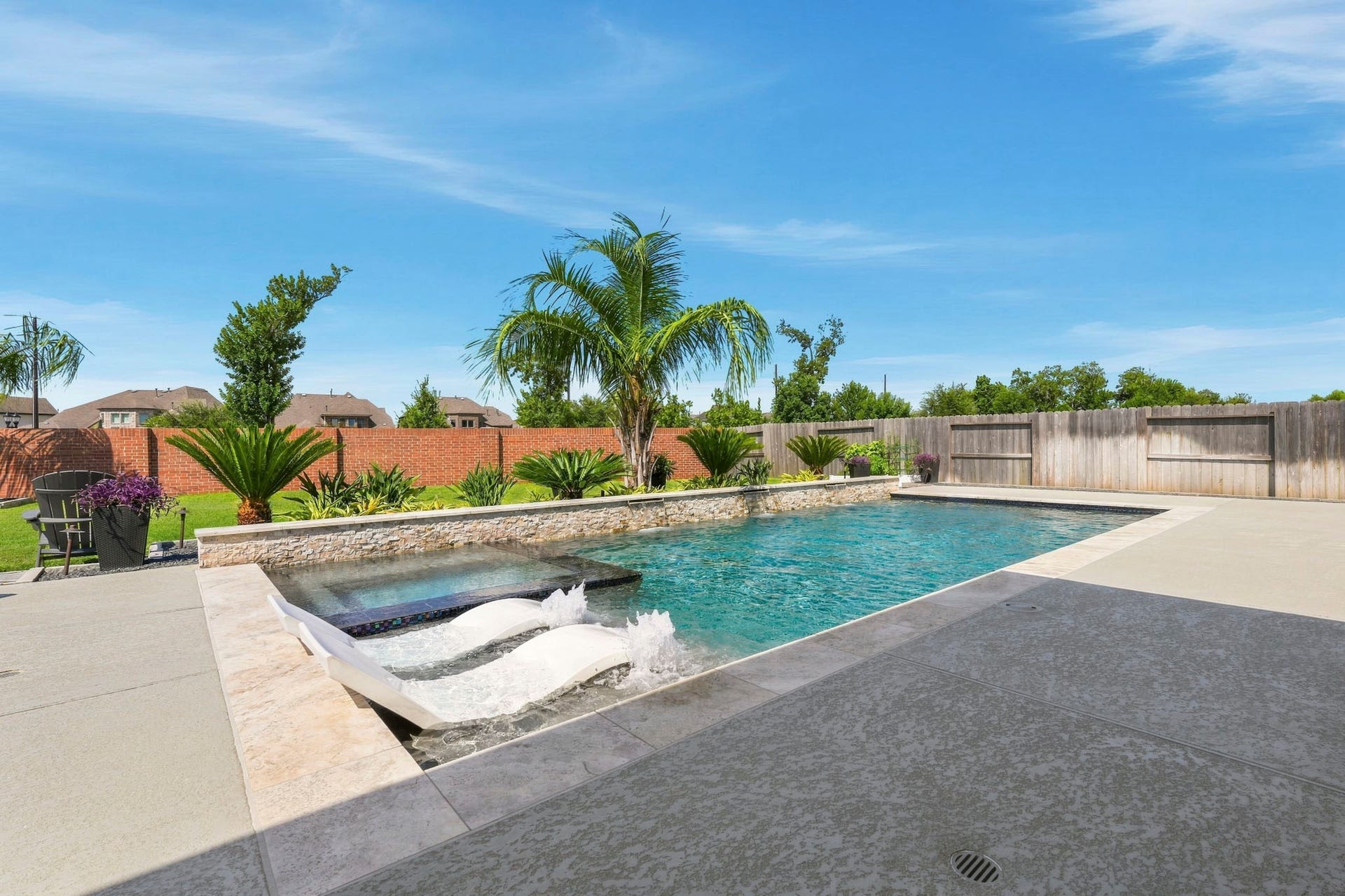 9907 Regal Bend Drive, Missouri City, TX 77459 Great Pool with tanning deck, 3 waterfalls, 2 bubblers, heater, LED lights and floor circulation system!