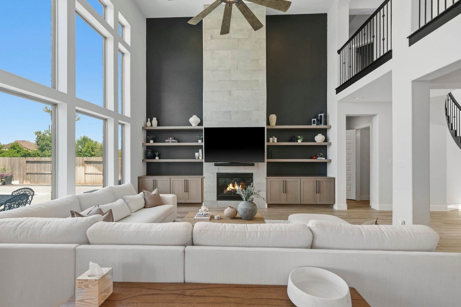 9907 Regal Bend Drive, Missouri City, TX 77459 Great Family room! Tiled fireplace wall, Custom Built-ins with floating shelves, Oversized 60" ceiling fan and a wall of windows