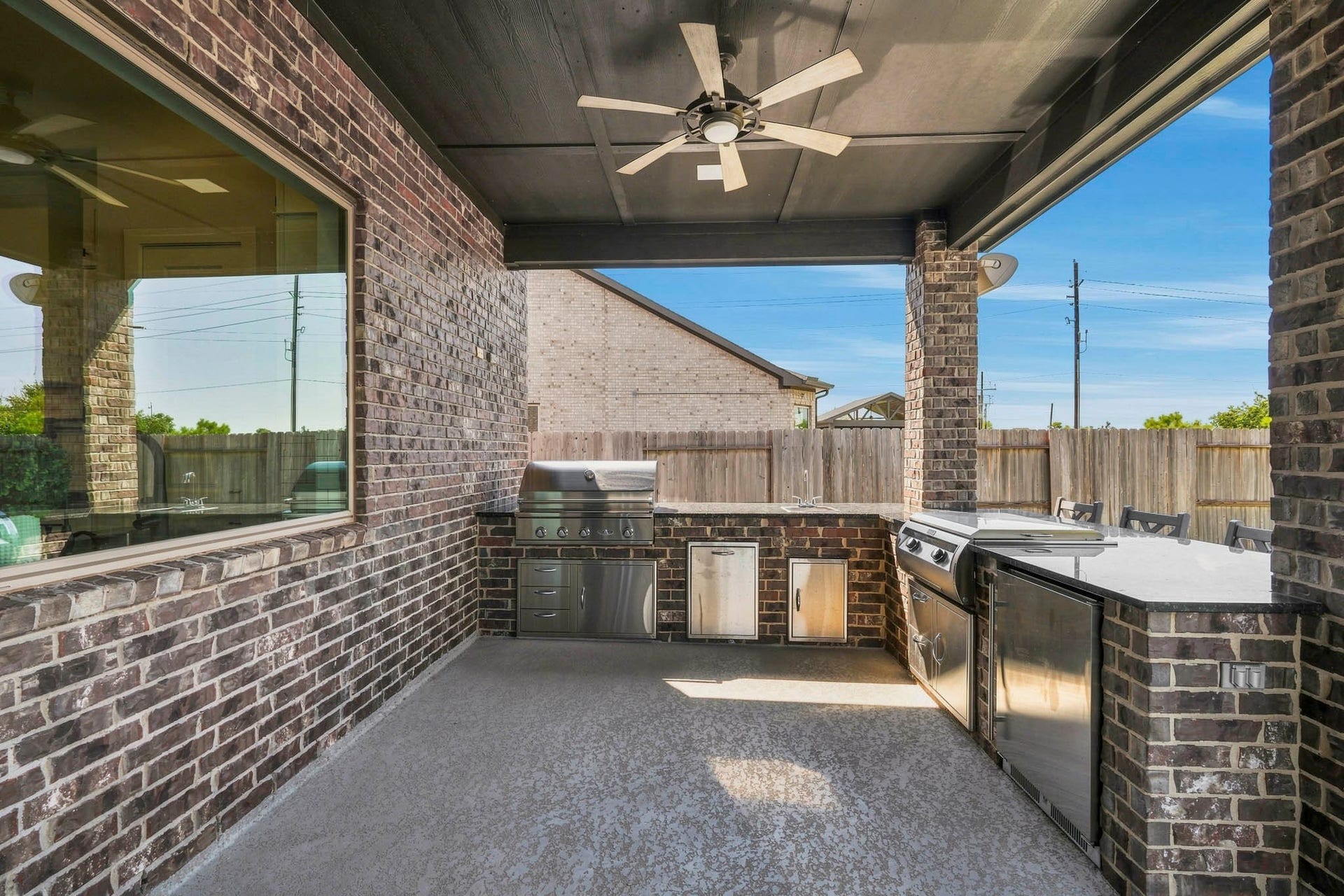 9907 Regal Bend Drive, Missouri City, TX 77459 Outdoor Kitchen, Grill, Griddle Beverage Fridge, sink and storage! Multiple Speakers, & Security cameras.