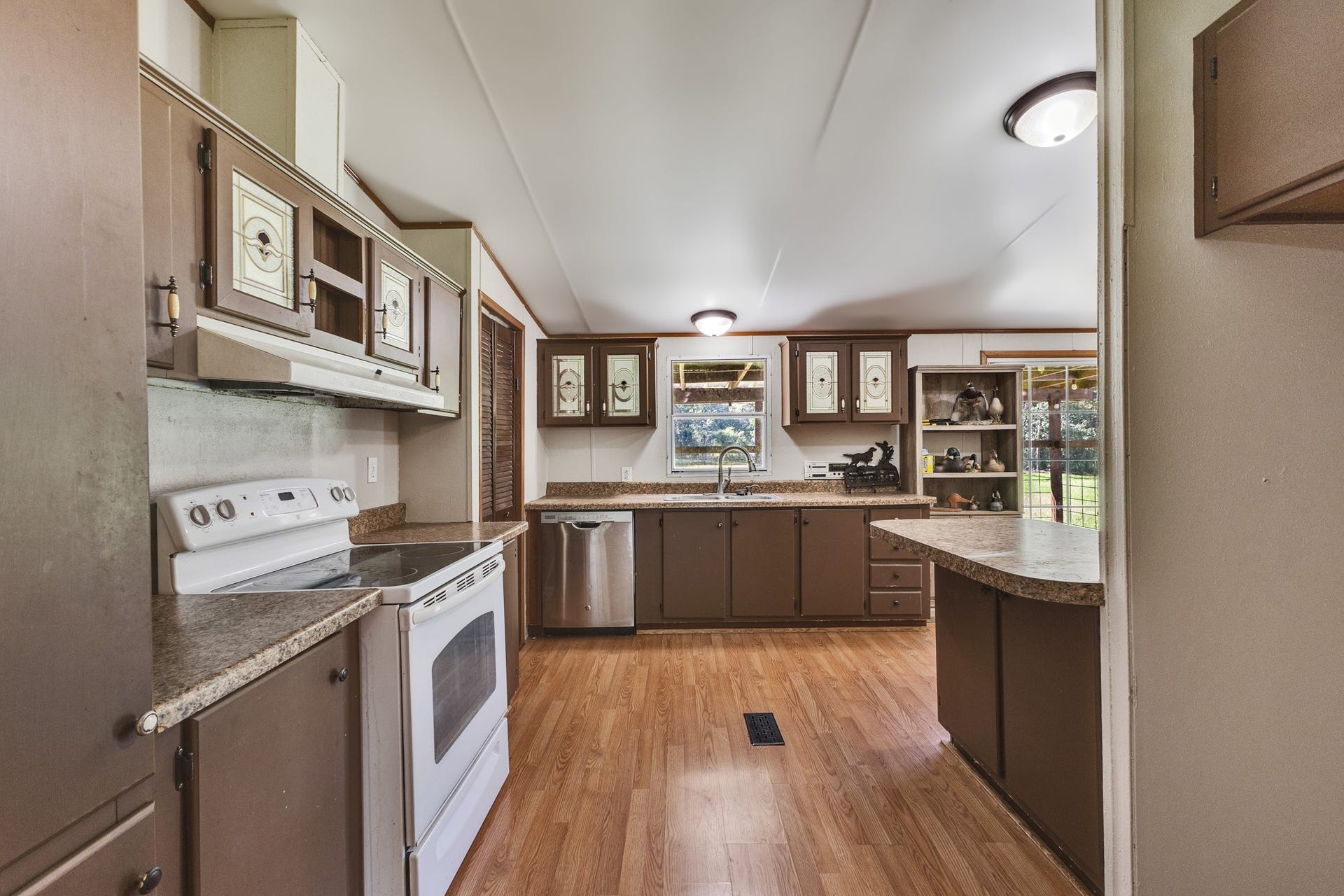 2009 Holder Rambo Road, Huffman, TX 77336 Spacious kitchen with lots of cabinetry, ample counter space, and natural light streaming through large windows.