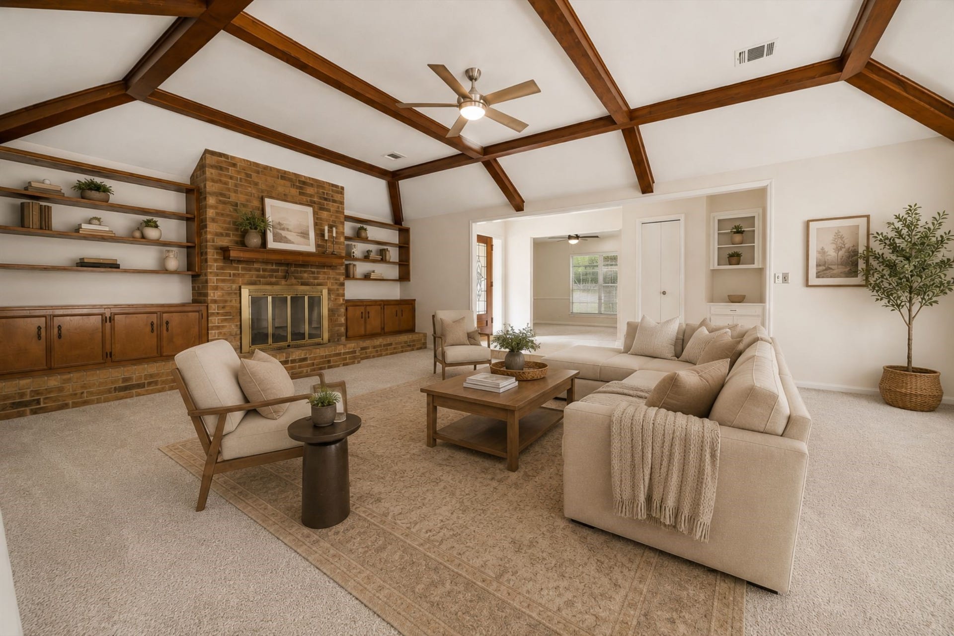 114 CAMELLIA STREET, Sugar Land, TX 77478 THE EXPANSIVE FAMILY ROOM SHOWCASES A VAULTED CEILING WITH EXPOSED WOOD BEAMS, A FULL BRICK FIREPLACE, AND EXTENSIVE BUILT-IN STORAGE. **Virtually Staged.