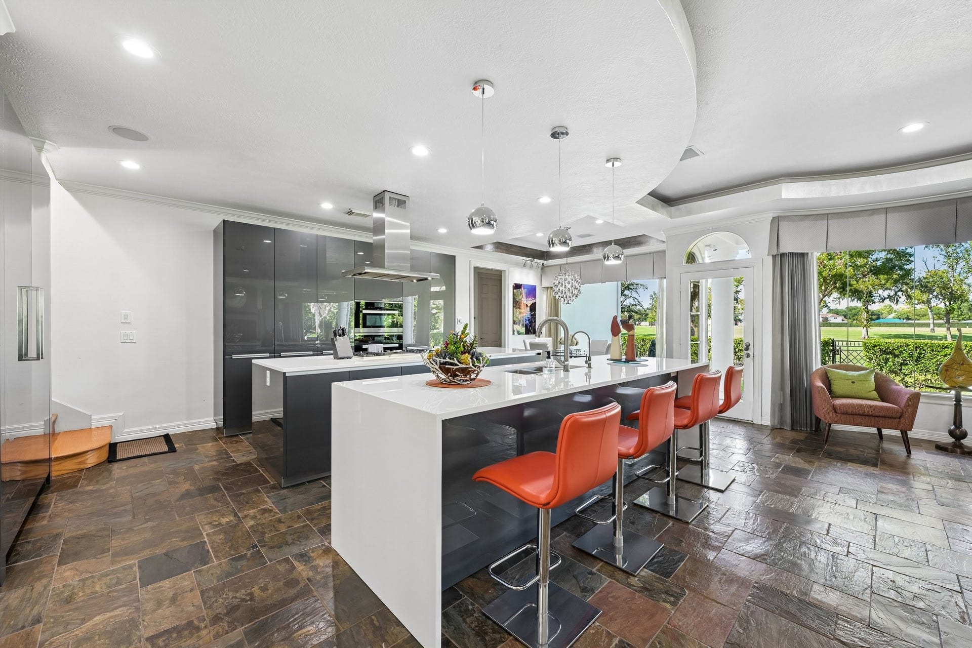 Kitchen with dual islands, sleek cabinetry, and contemporary design