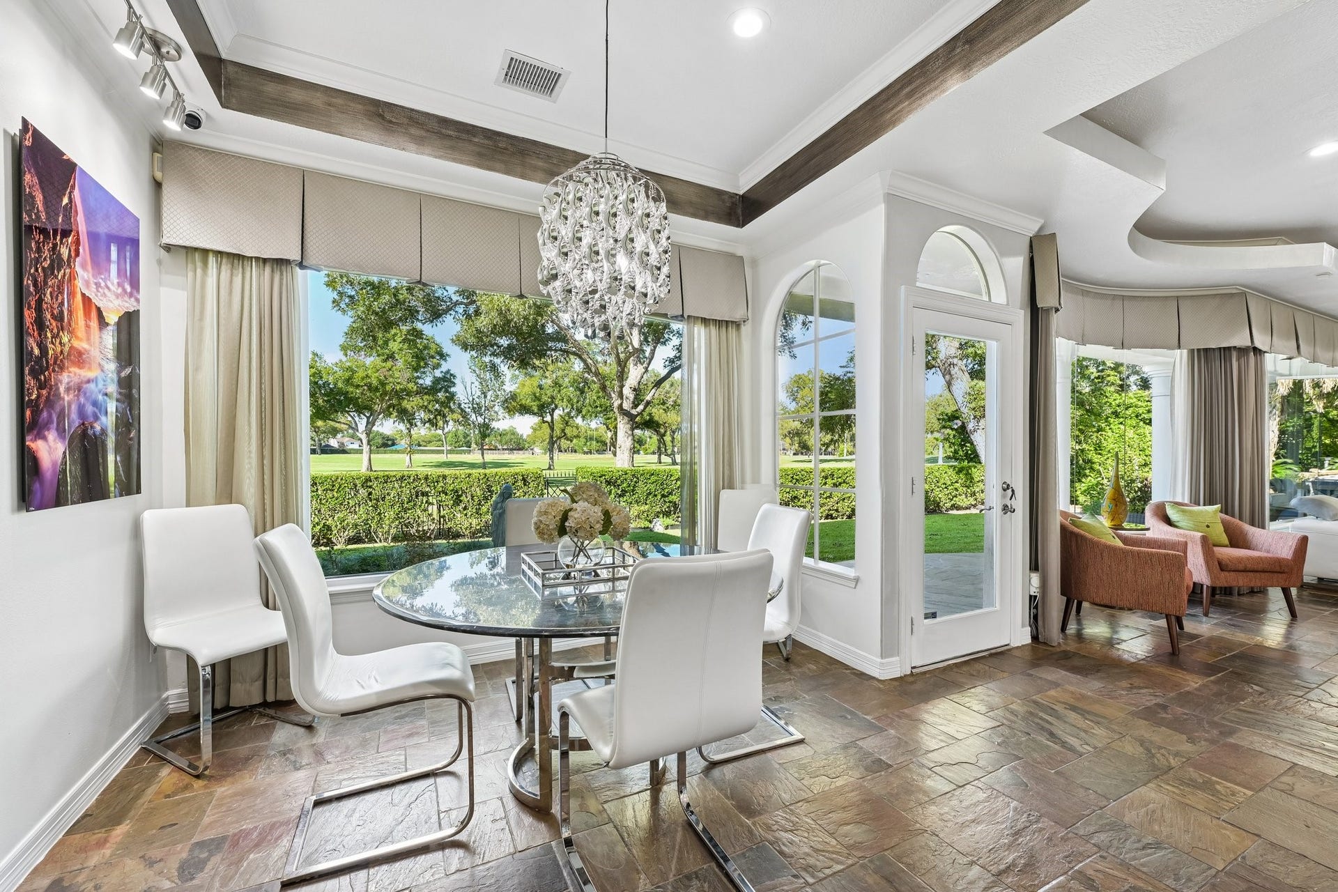 Inviting breakfast area overlooking the golf course, offering a bright and scenic setting for everyday dining