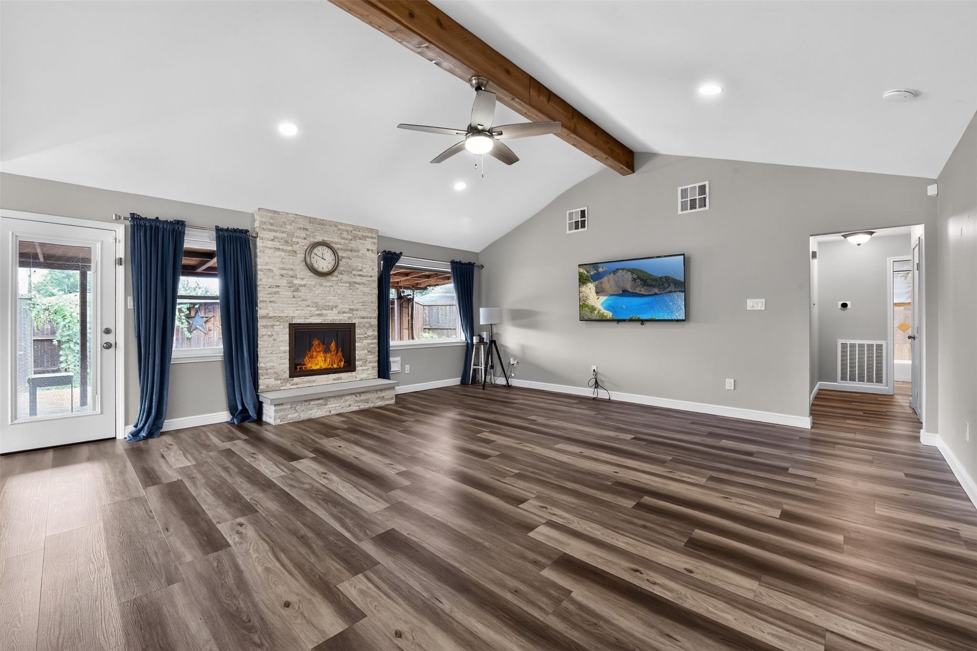 1918 Oaklawn Street, Sugar Land, TX 77498 Fireplace and windows overlooking the backyard provide focal point for the living area.