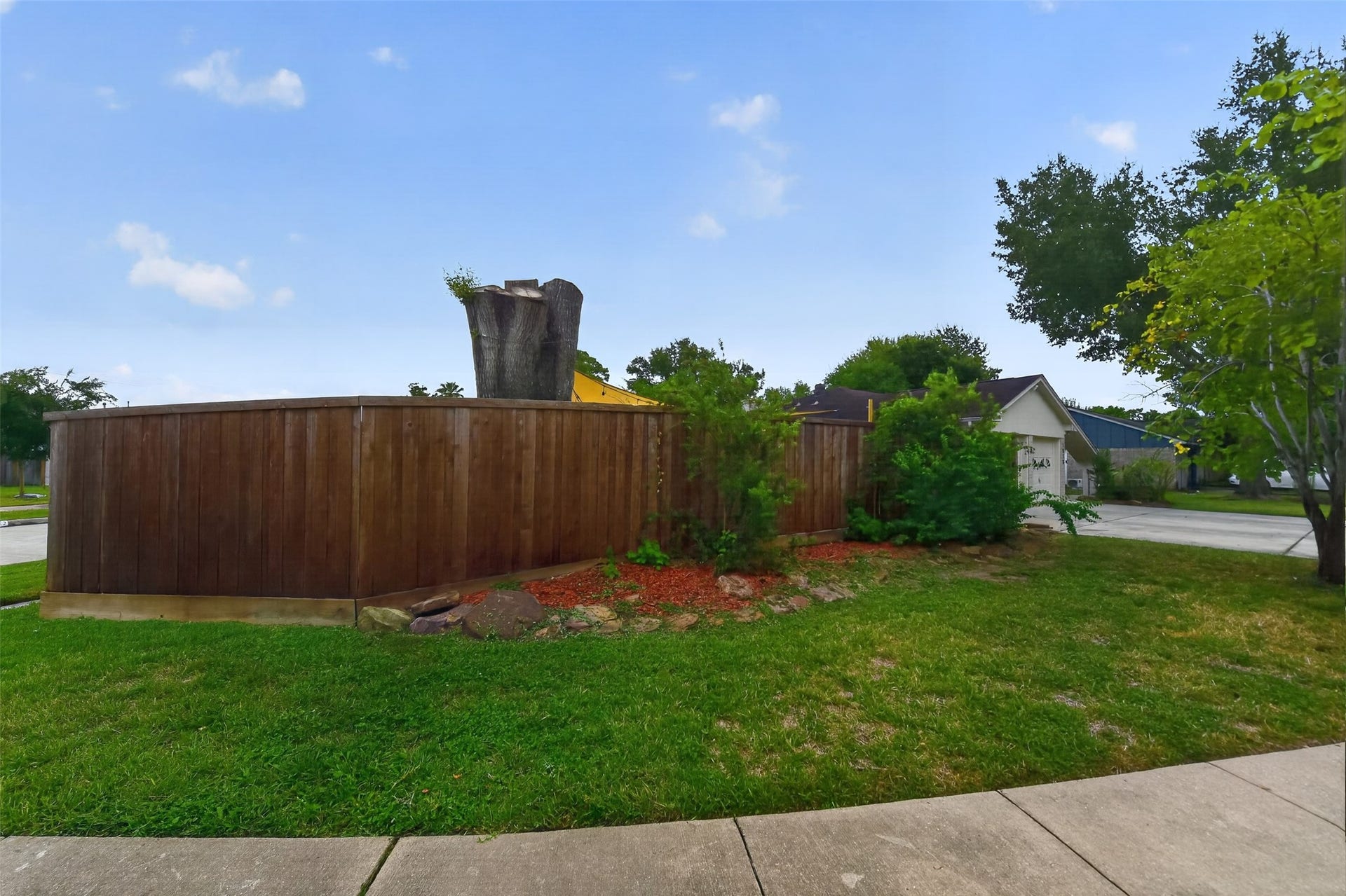 1918 Oaklawn Street, Sugar Land, TX 77498 Corner lot has lots of green space for kicking a soccer ball or tossing a baseball.