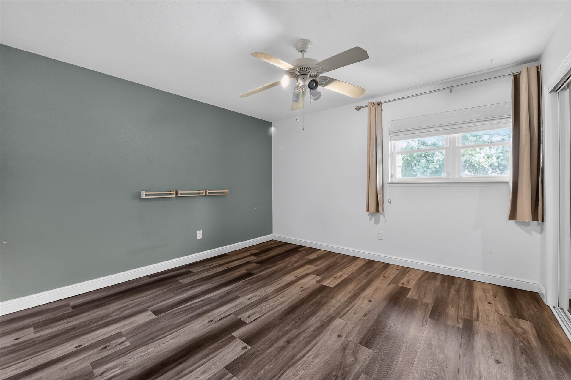 1918 Oaklawn Street, Sugar Land, TX 77498 One of two secondary bedrooms...large window with view of the front.