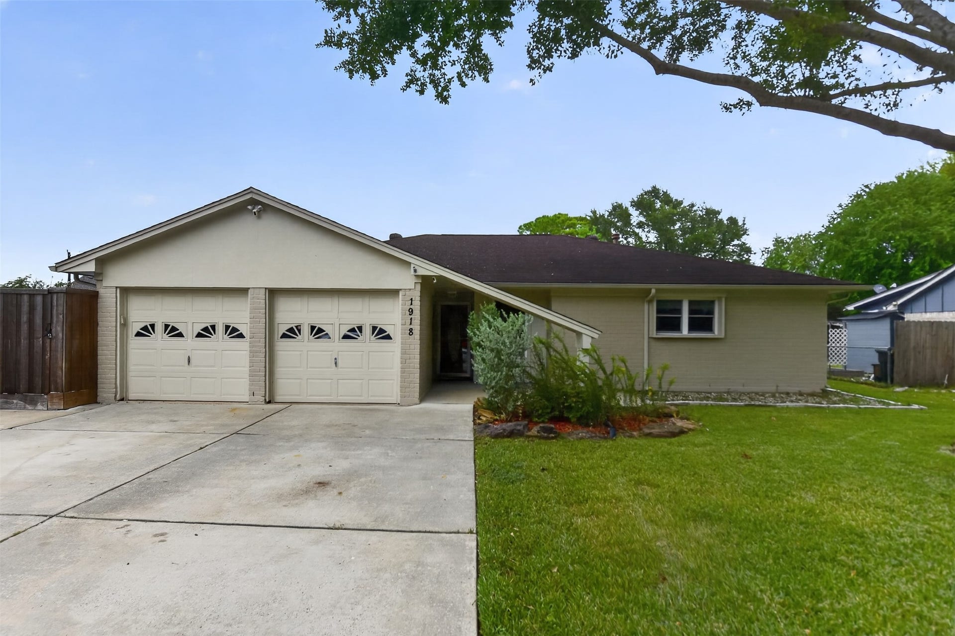 1918 Oaklawn Street, Sugar Land, TX 77498 Cute curb appeal and attached garage with separate doors.