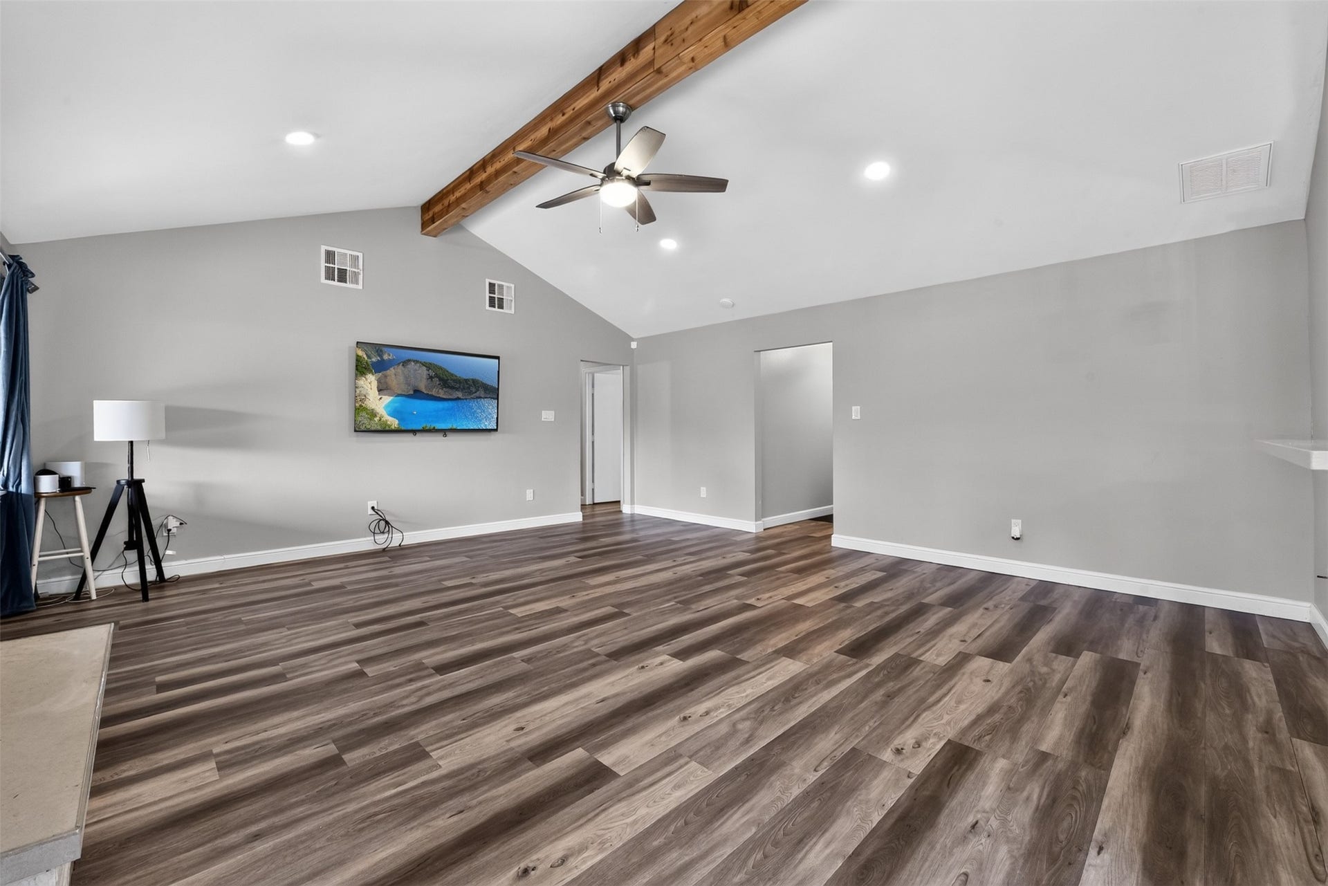 1918 Oaklawn Street, Sugar Land, TX 77498 Step inside to see the open living area with high vaulted ceiling and luxury vinyl flooring.