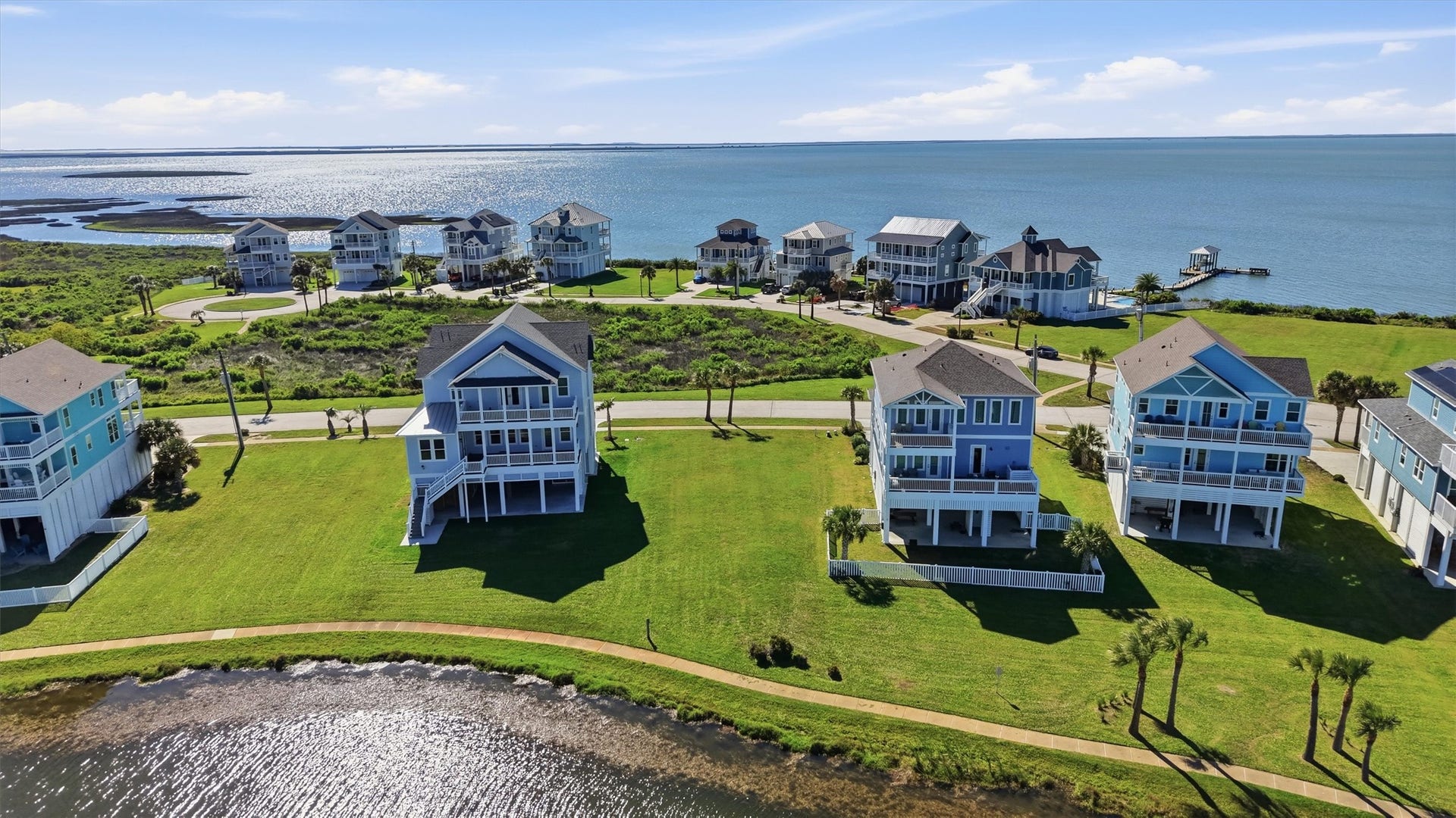 The surrounding homes reflect the charm and quality of Pointe West, adding to the appeal and long-term value of this desirable homesite.