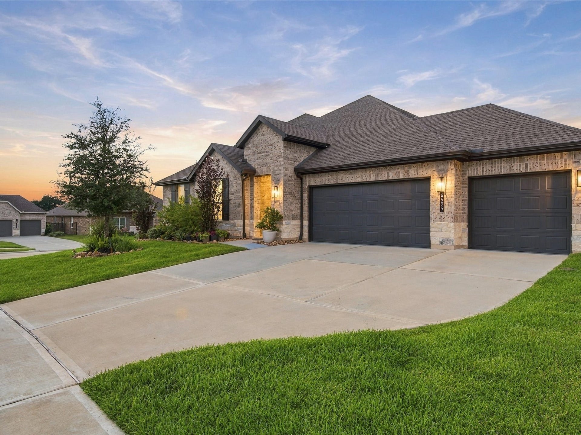 3 Car Garage, perfect for extra storage or space for your golf cart. Spacious storage attic included!