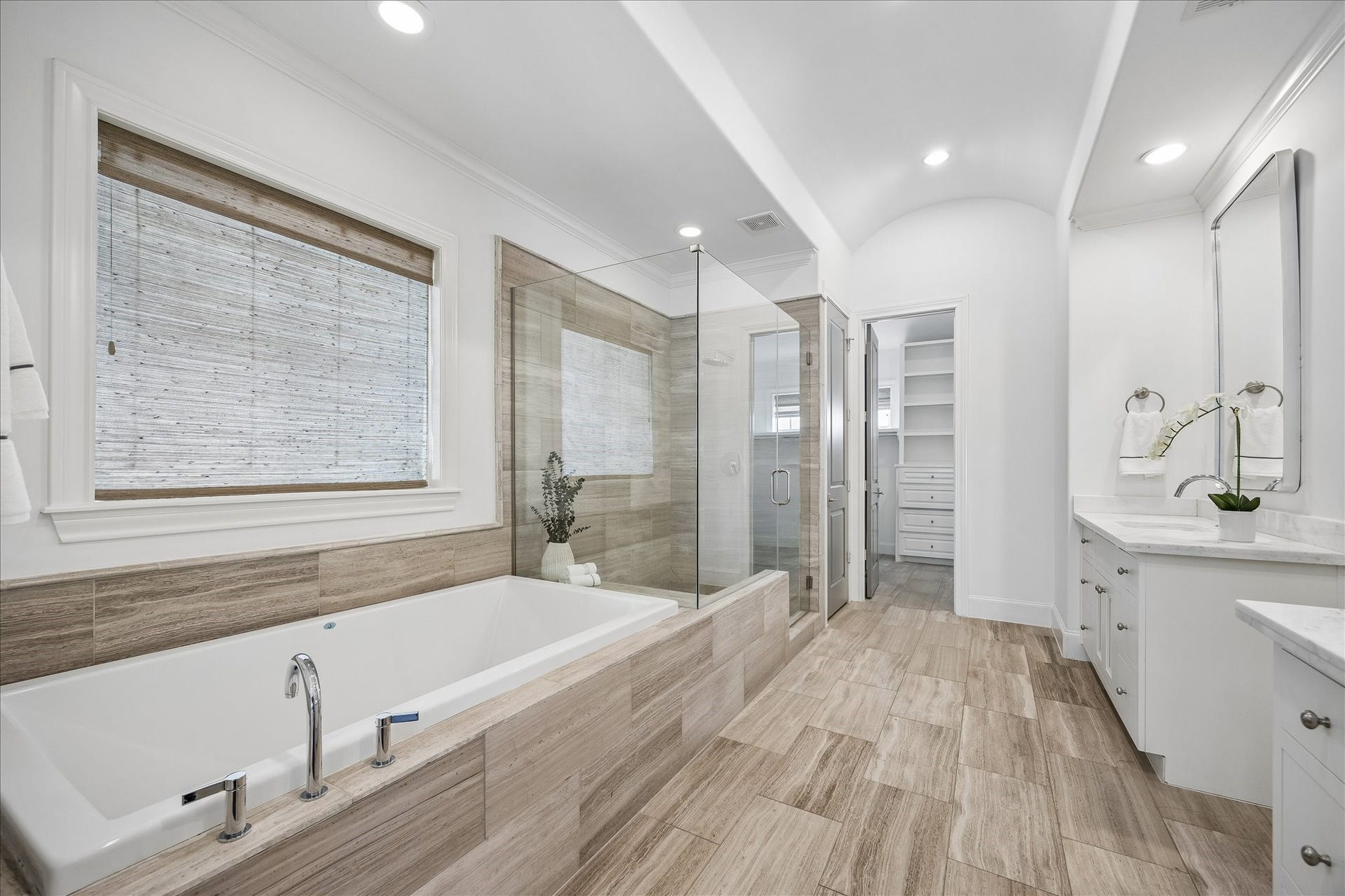 1208 Mosaico Lane, Houston, TX 77055 primary bathroom with soaking tub and separate shower, 2 walk-in closets, built-ins, double sinks