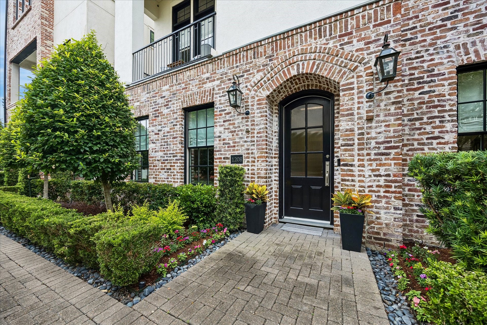 1208 Mosaico Lane, Houston, TX 77055 front door with lovely fresh landscaping