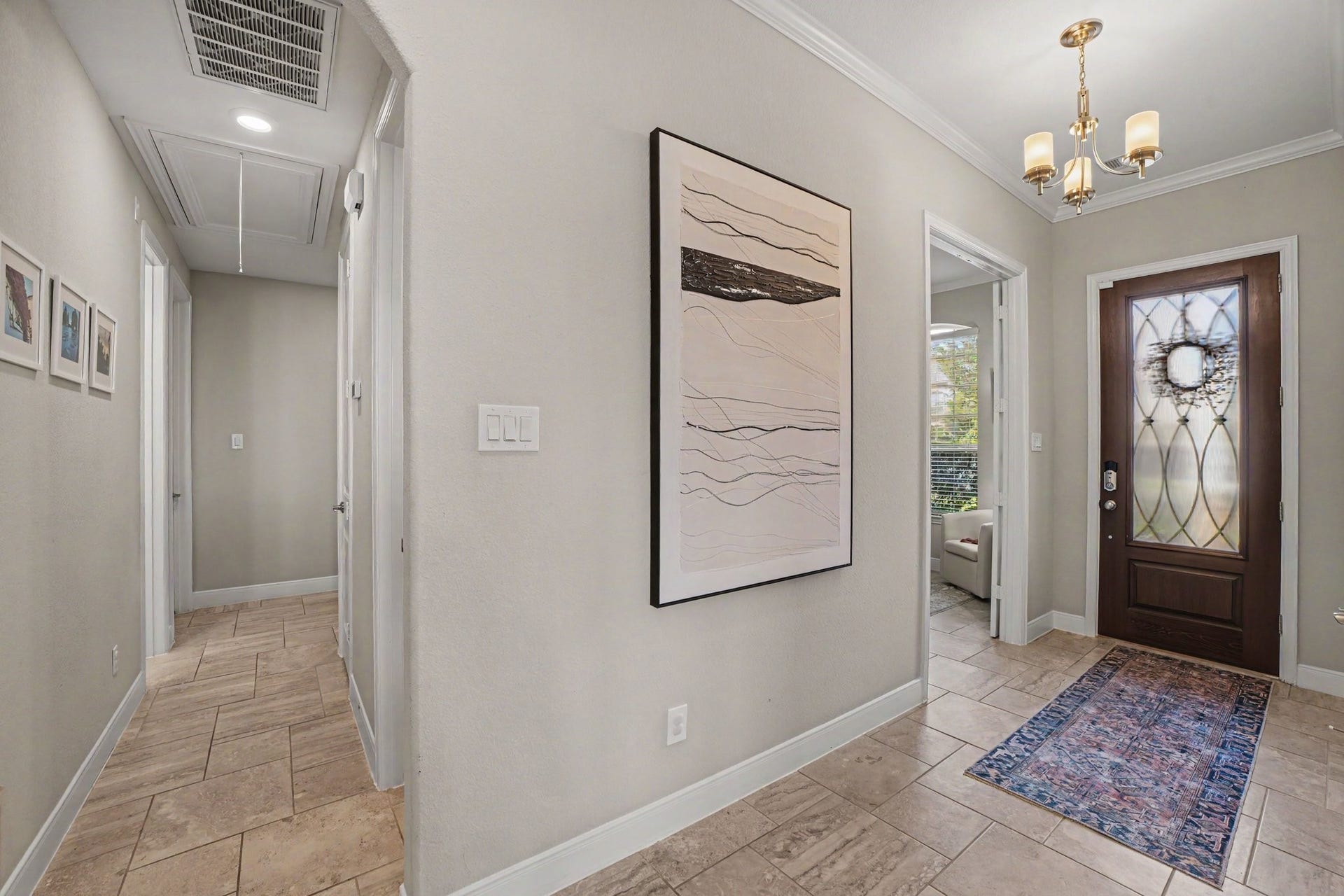 26438 Morgan Creek Lane, Katy, TX 77494 Step inside and feel immediately at home in this warm, inviting foyer that sets a gracious tone for the rest of this beautiful residence. As you pass through the ornate, glass-paneled wood front dooradorned with a welcoming decorative wreathyou are greeted by an abundance of natural light and a sense of open, airy comfort.