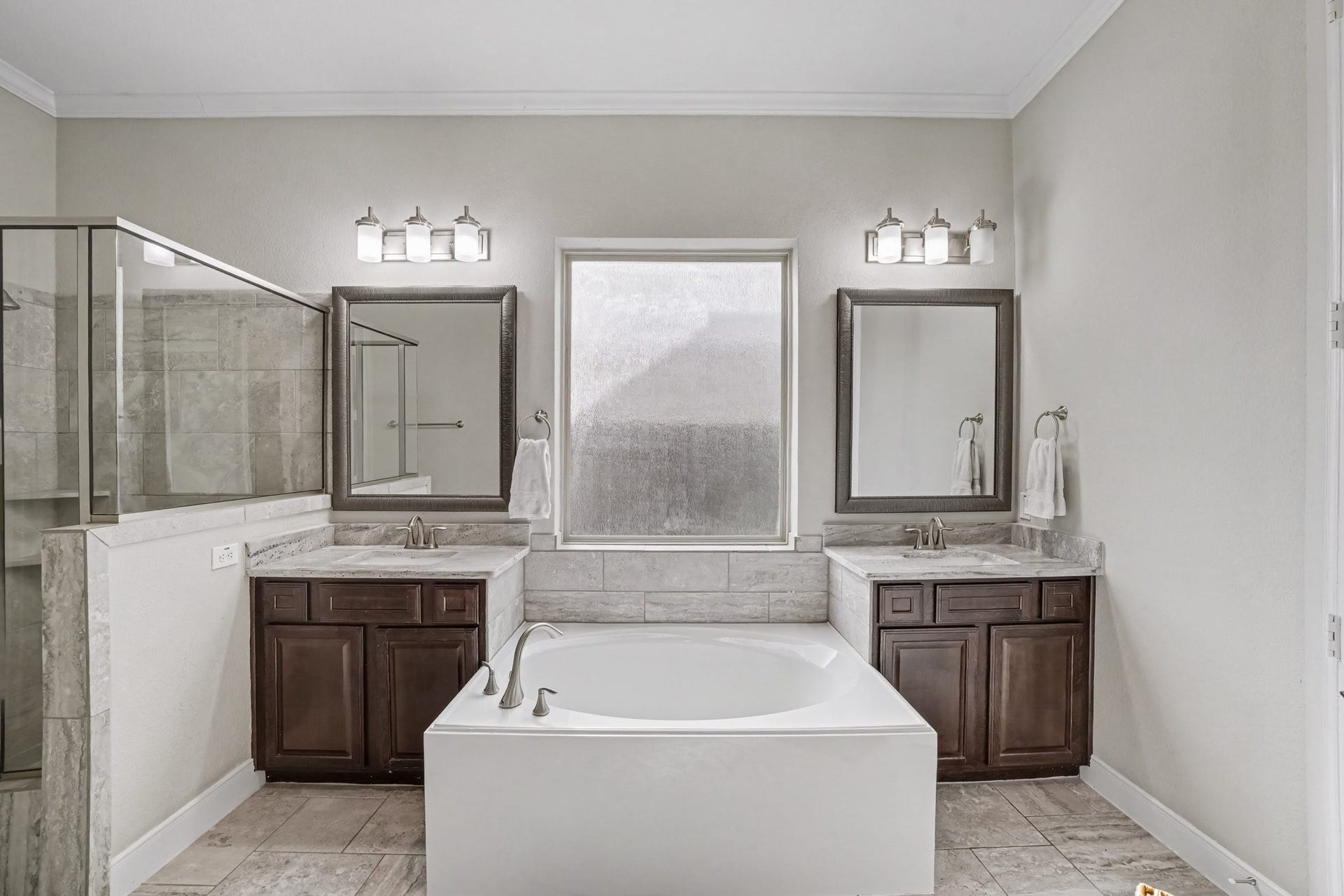 26438 Morgan Creek Lane, Katy, TX 77494 Indulge in a spa-like retreat within this luxurious ensuite primary bathroom, thoughtfully designed for relaxation and comfort.