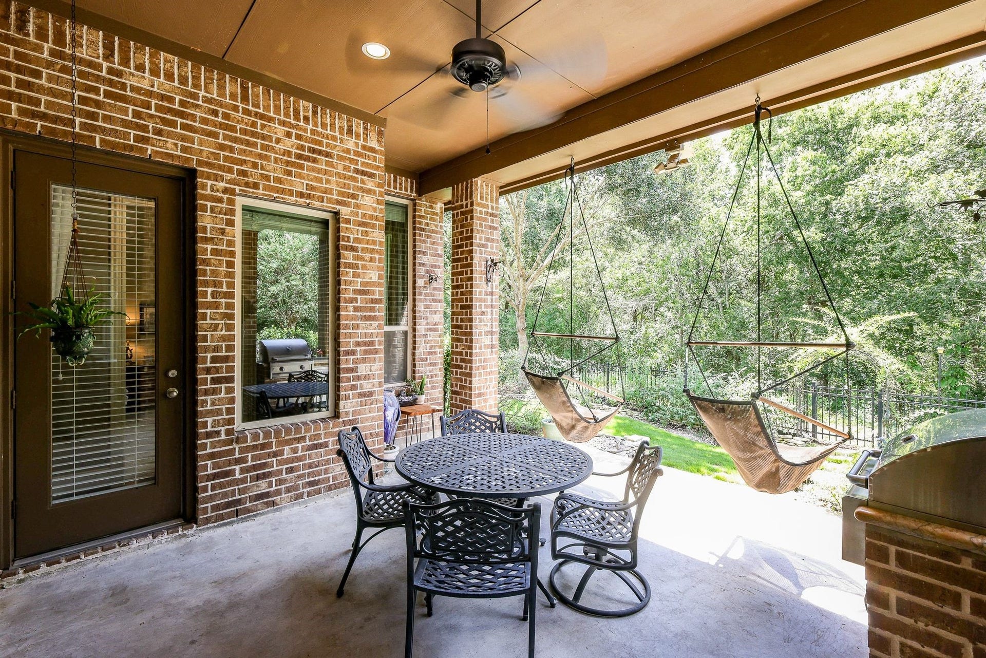 4715 Trickle Creek Court, Fulshear, TX 77441 Covered back patio overlooking a gorgeous wooded creek backyard.