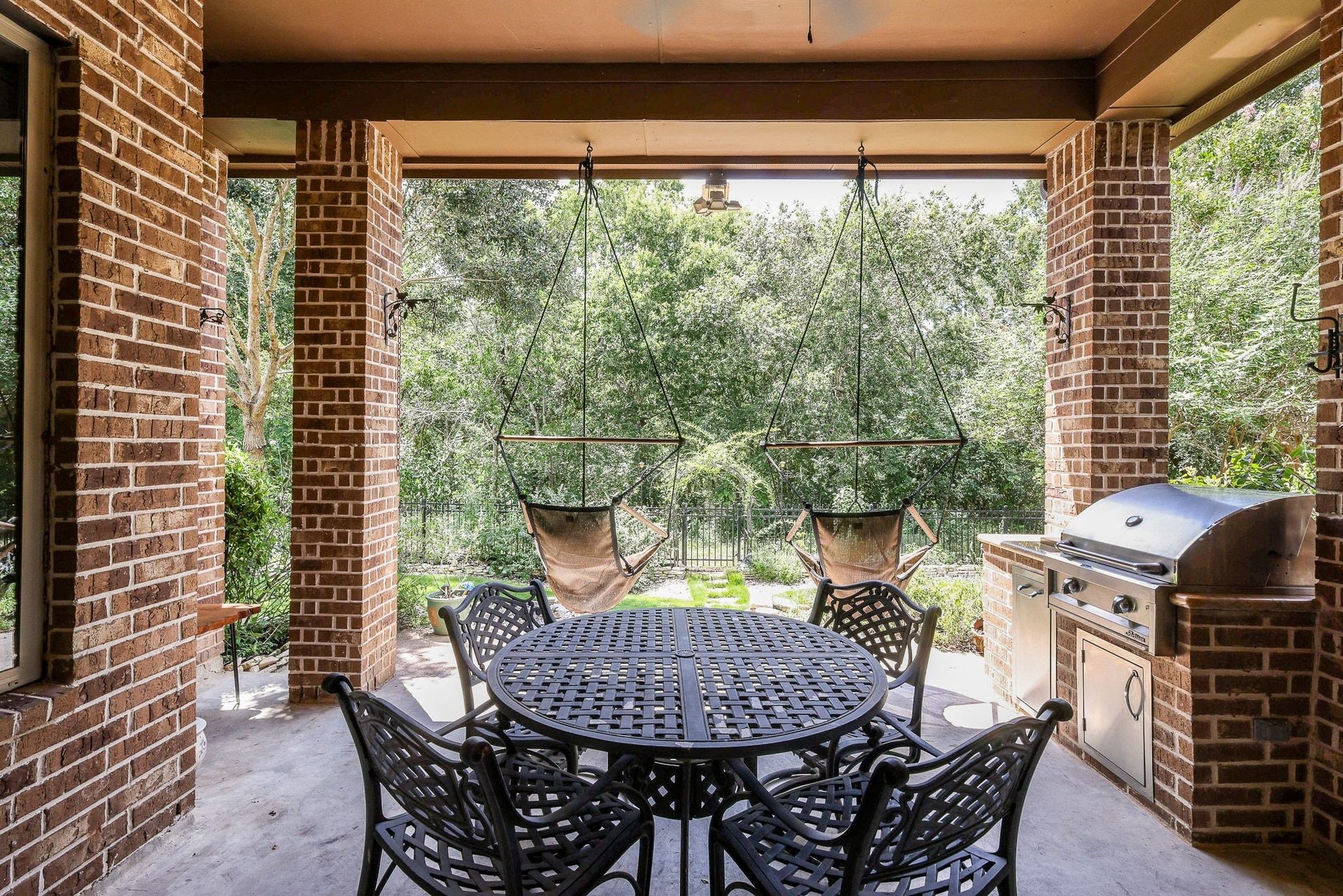 4715 Trickle Creek Court, Fulshear, TX 77441 Covered back patio with built-in outdoor kitchen.