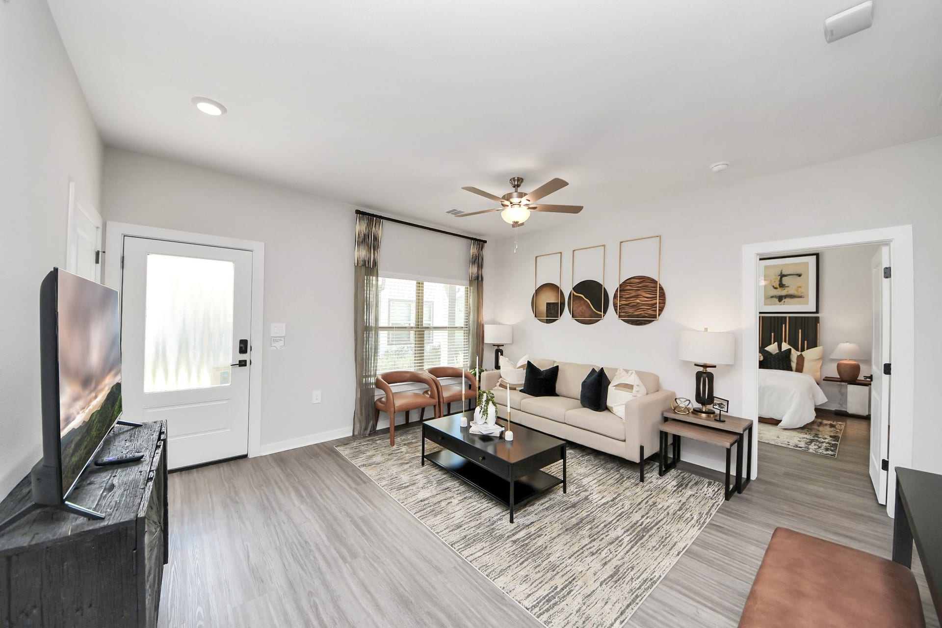 Boasting luxury finishes-stylish Island kitchen,granite counters,subway tile backsplash,ample custom cabinet space,stainless appliances,refrigerator,full size washer&dryer included,wood-like flooring throughout,open concept floor plan.