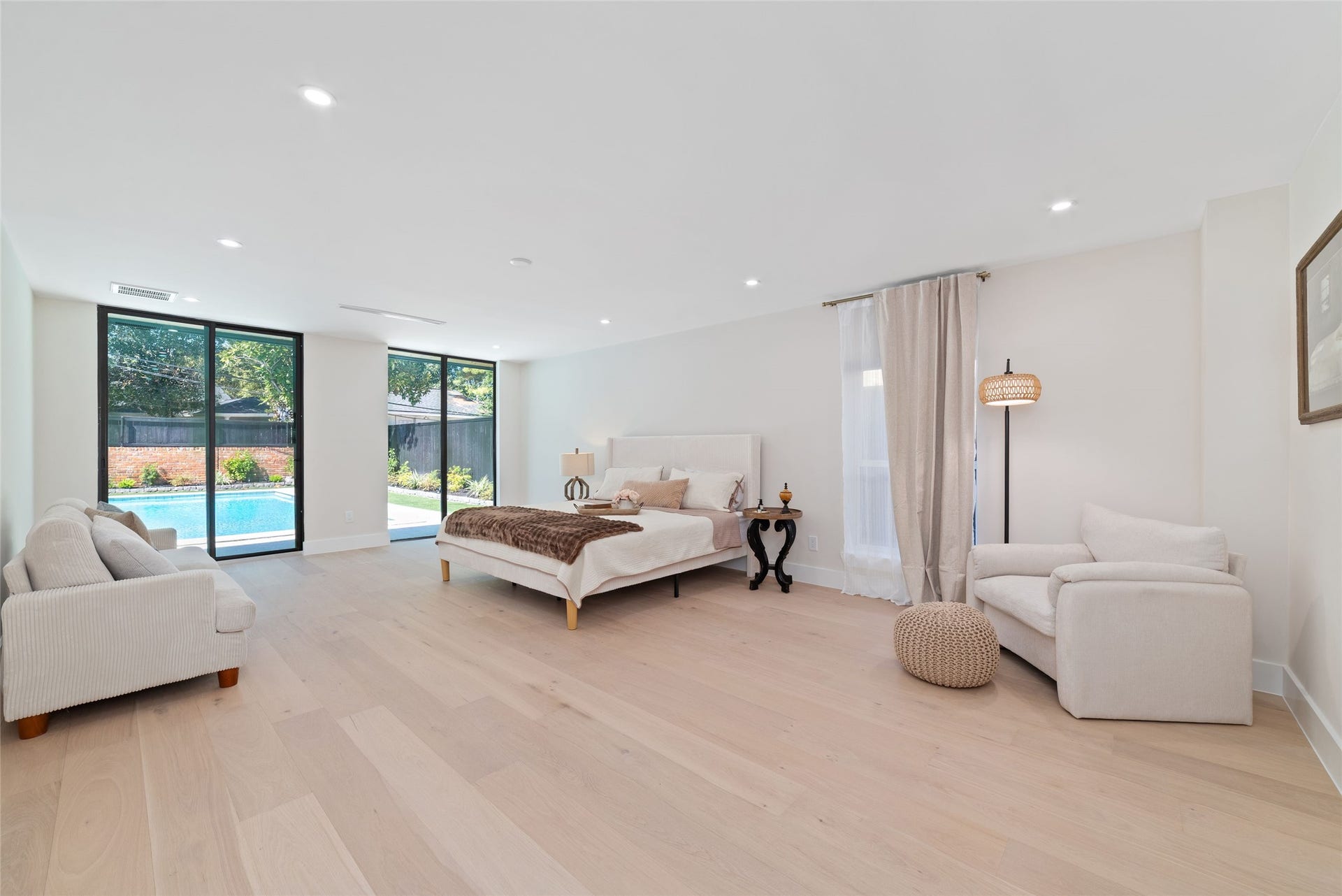 Grand Primary Bedroom with stilling areas and access to the gorgeous pool.