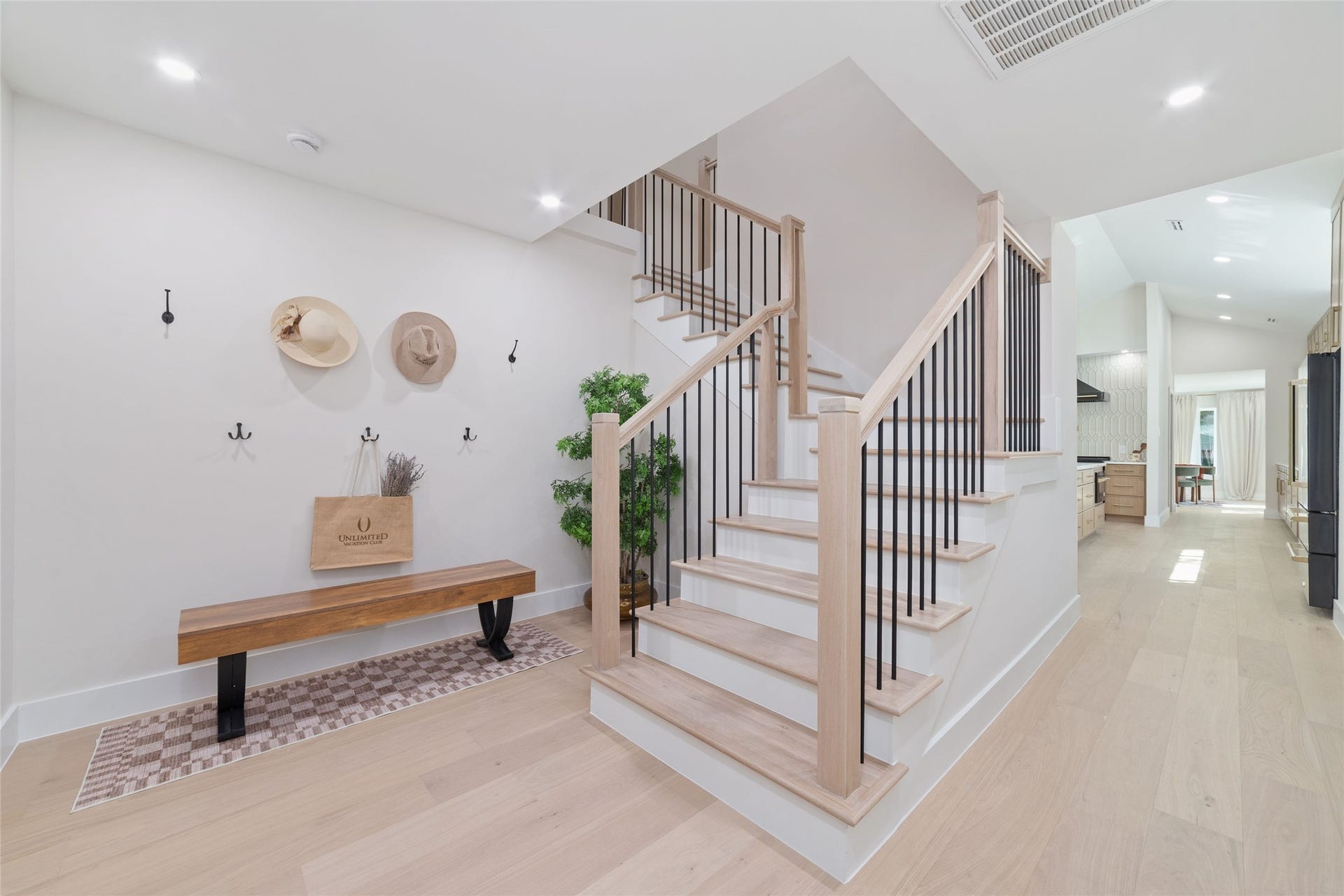 Mud Room at the entrance from the Garage with back stairs up to the secondary bedrooms.
