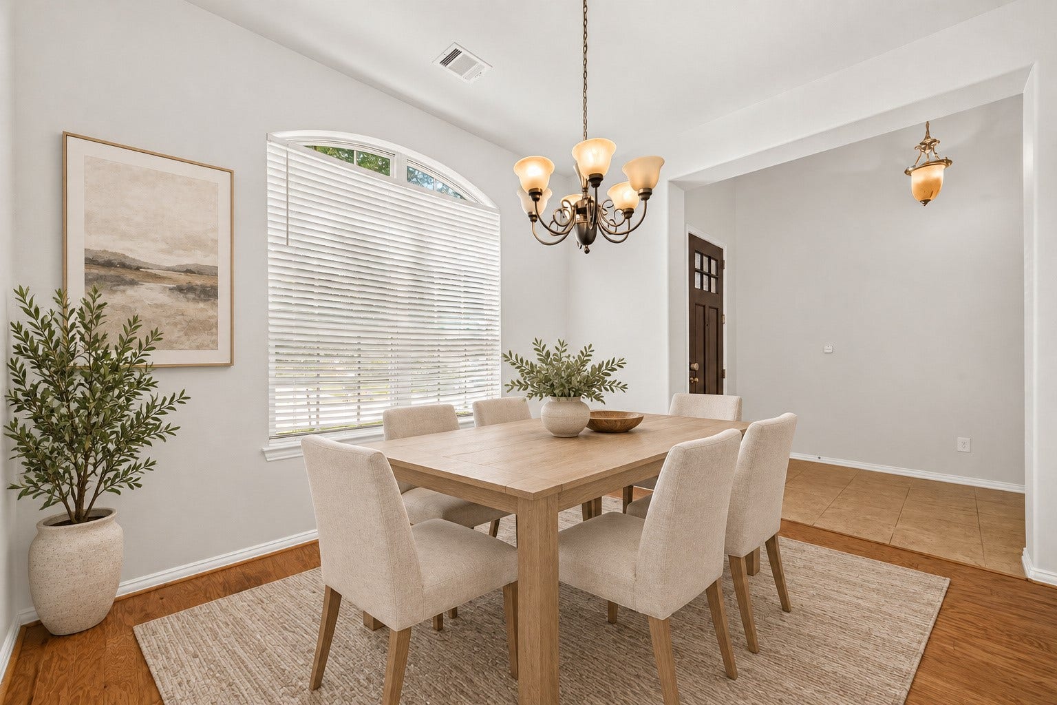 8155 Laughing Falcon Trail, Conroe, TX 77385 Formal dining room with a wide opening to the entry area and double doors providing direct access to the kitchen. Virtually Staged.