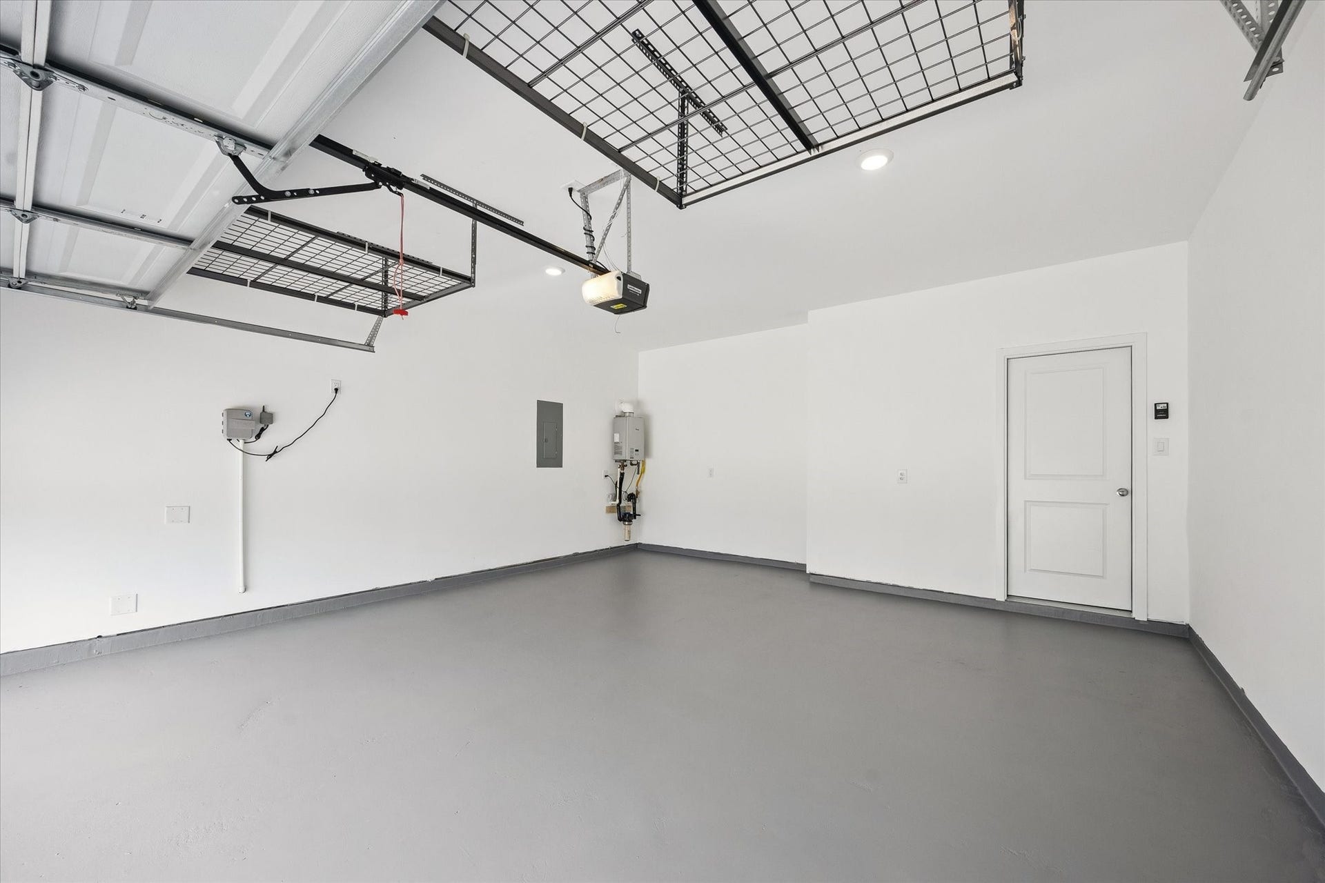 9510 Honey Run Lane, Cypress, TX 77433 The garage is finished with durable epoxy flooring and features a tankless water heater and convenient overhead storage racks, maximizing both function and storage space!