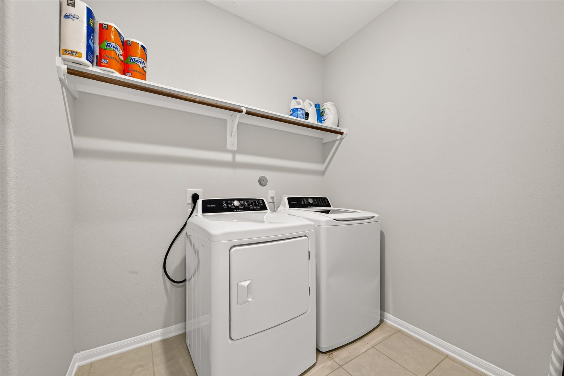 10707 Amador Peak Drive, Rosharon, TX 77583 Utility room with storage shelf. Washer & Dryer included.