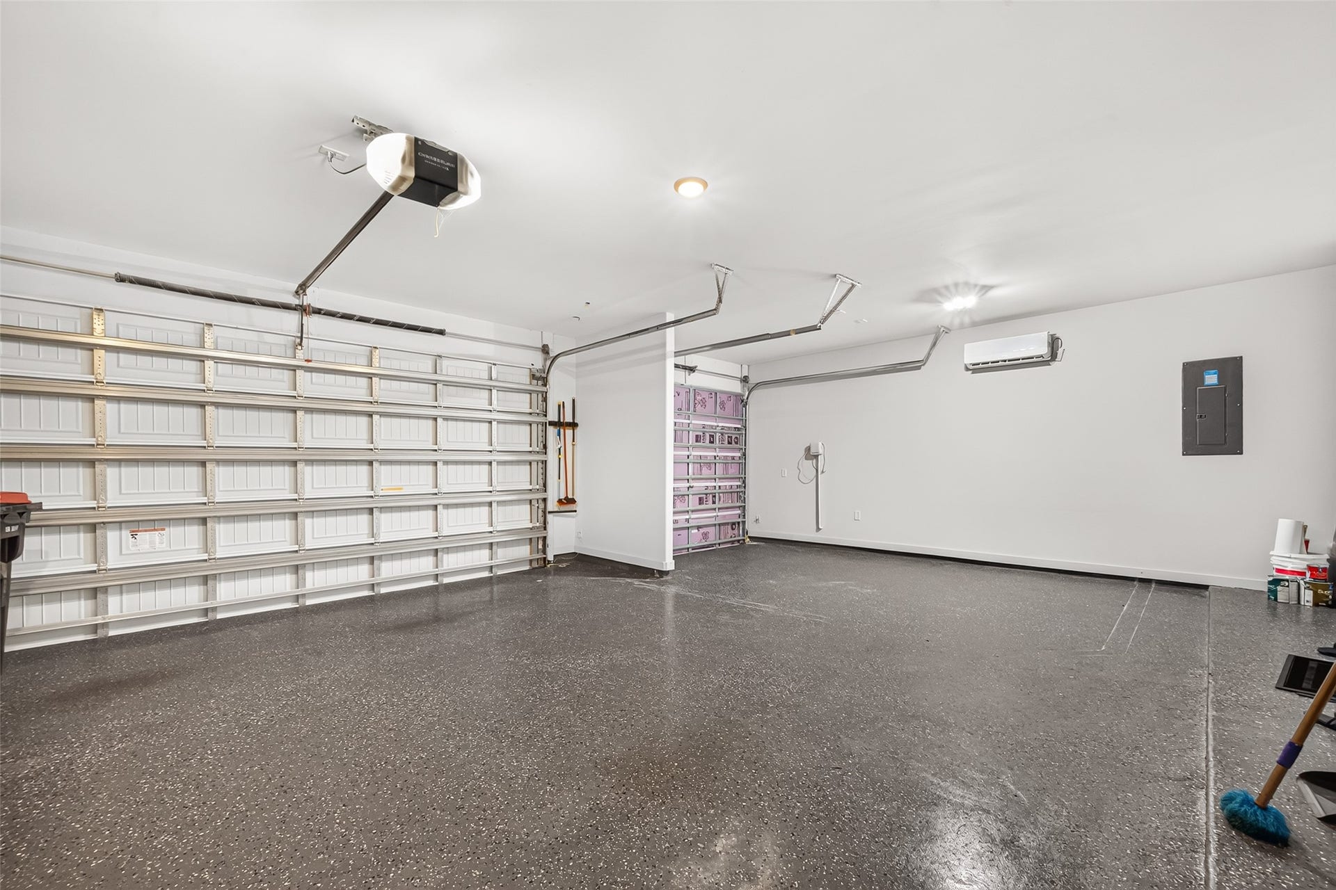 10707 Amador Peak Drive, Rosharon, TX 77583 3-car garage includes seller upgraded epoxy flooring & ac-unit fit for an at home gym or workshop.