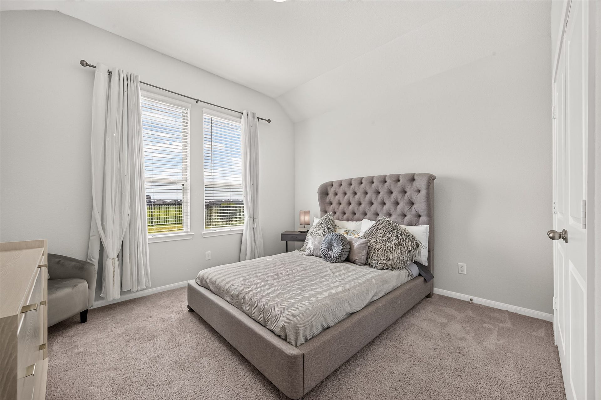 10707 Amador Peak Drive, Rosharon, TX 77583 Other secondary bedroom nearest the back of the home, ample closet space.Views of the backyard & water. Inquire about furniture, most available.