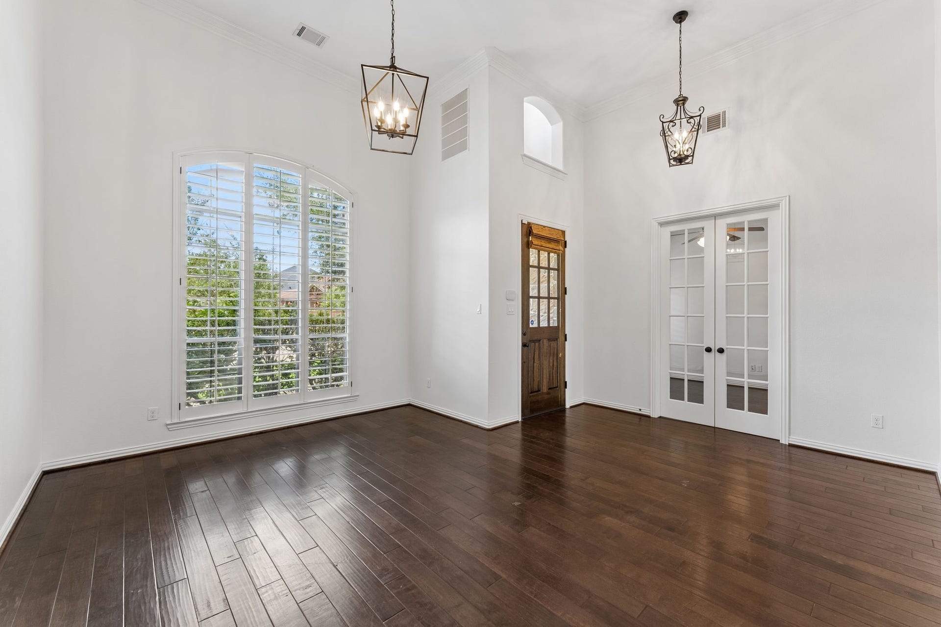 8210 Thunder Ridge Way, Missouri City, TX 77459 Elegant living area with double French glass doors opening to a bright office or study.