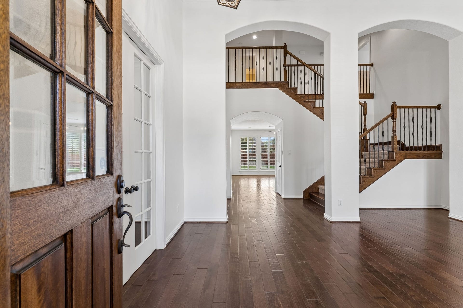 8210 Thunder Ridge Way, Missouri City, TX 77459 Step into the stunning two-story living area with a seamless view extending to the family room. Downstairs living areas and kitchen recently painted an Alabaster white.