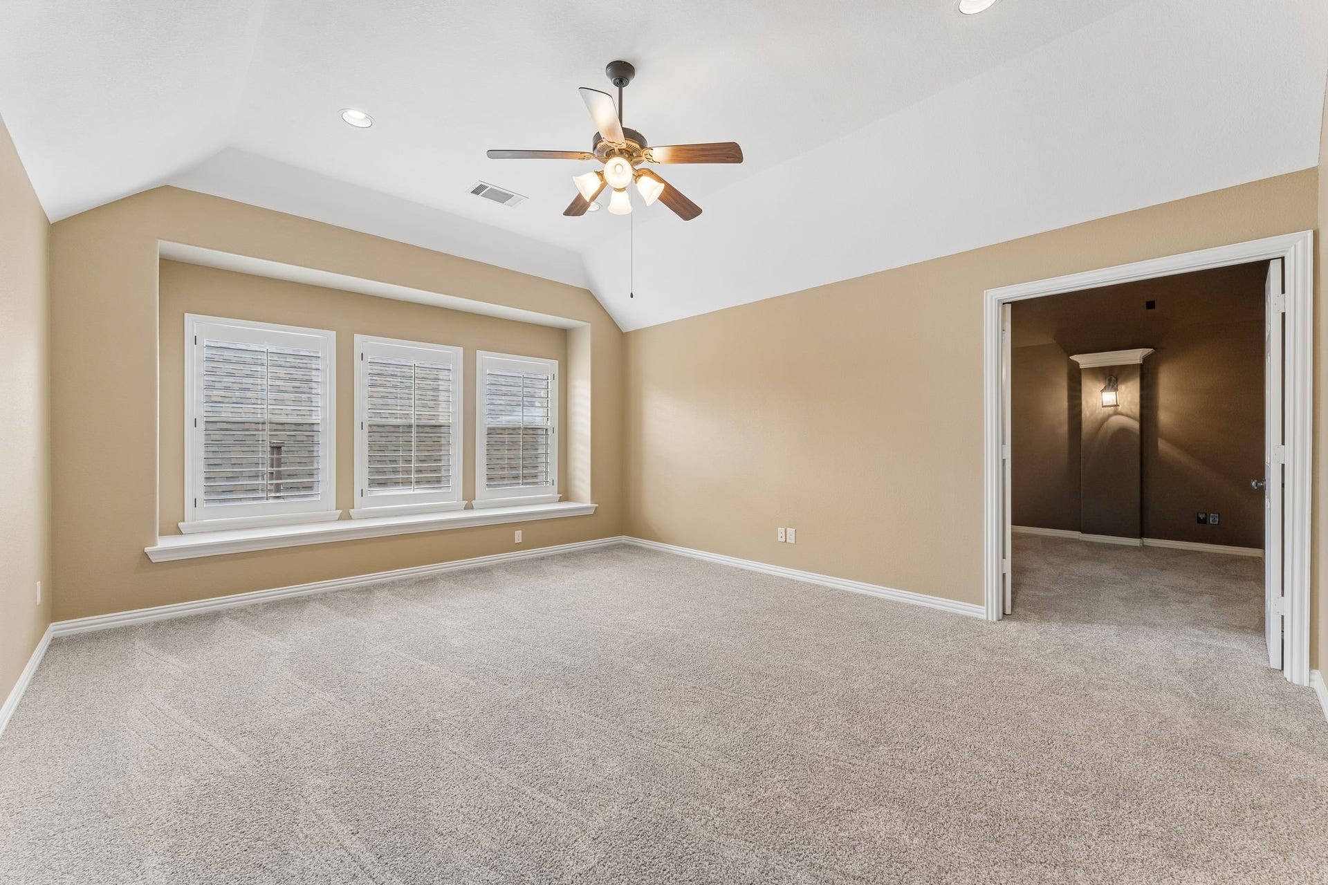 8210 Thunder Ridge Way, Missouri City, TX 77459 Spacious upstairs bonus room perfect for a family or play area, with double doors opening to a cozy media room.