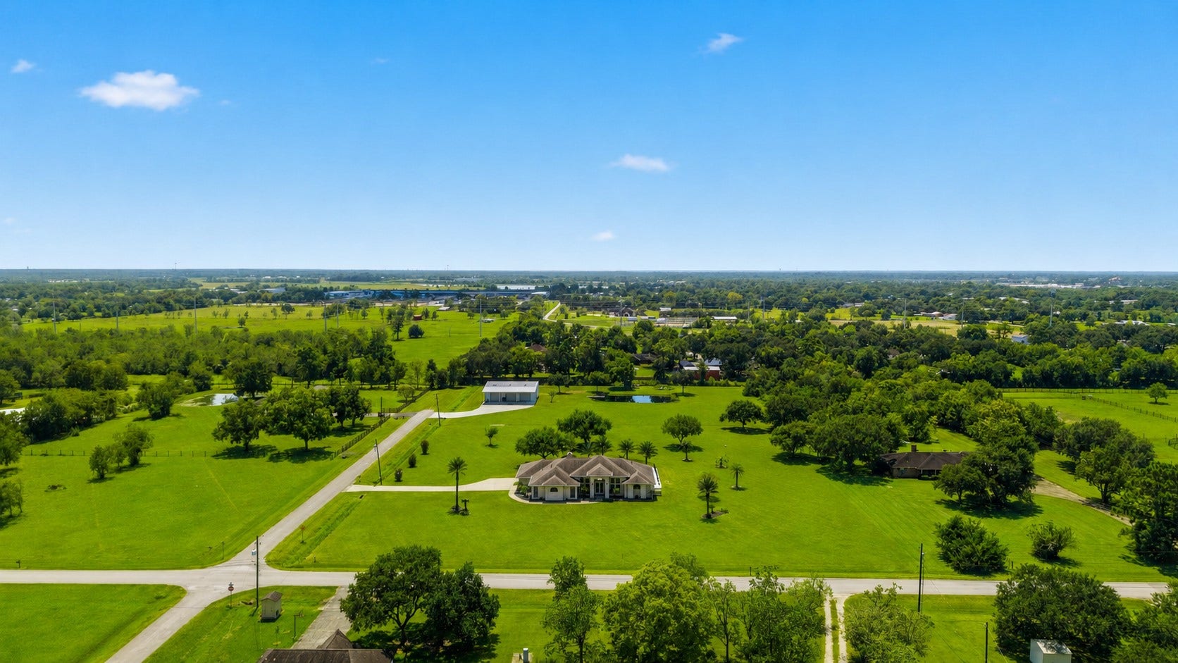 835 Hall Road, Alvin, TX 77511 Beautiful exterior with mature landscaping and abundant open space