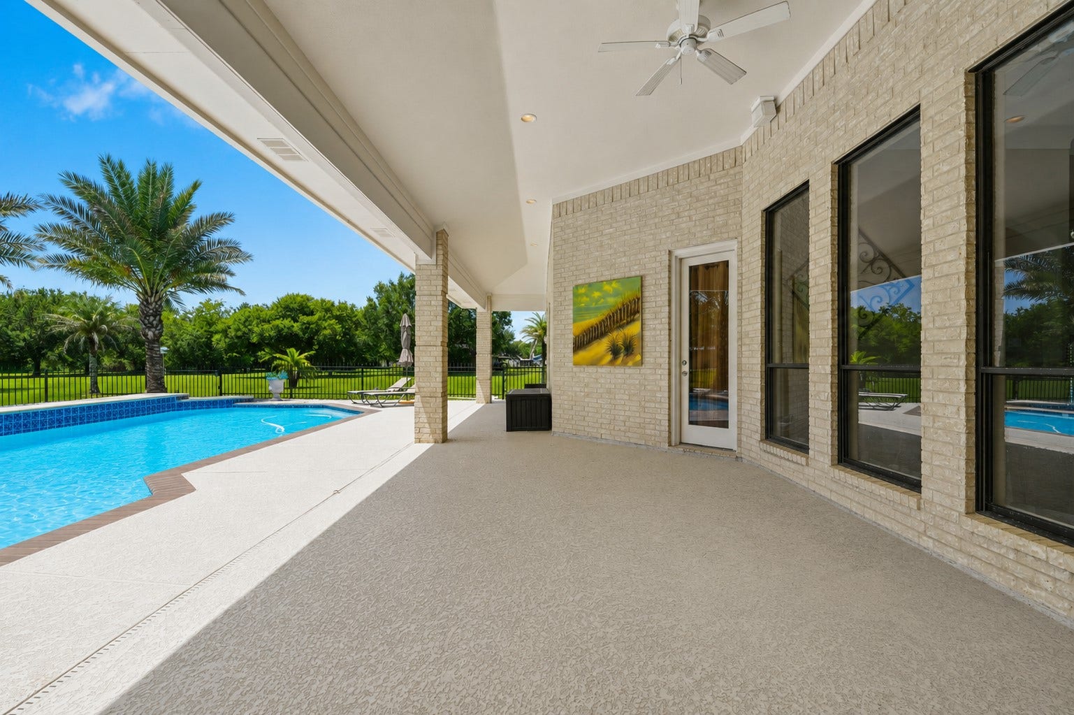 835 Hall Road, Alvin, TX 77511 Expansive covered outdoor living area with pool views