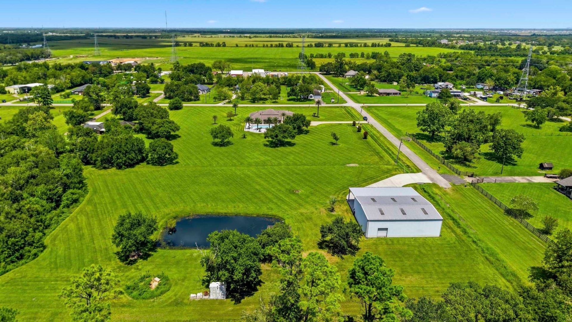 835 Hall Road, Alvin, TX 77511 Rear aerial view showcasing the home's impressive setting