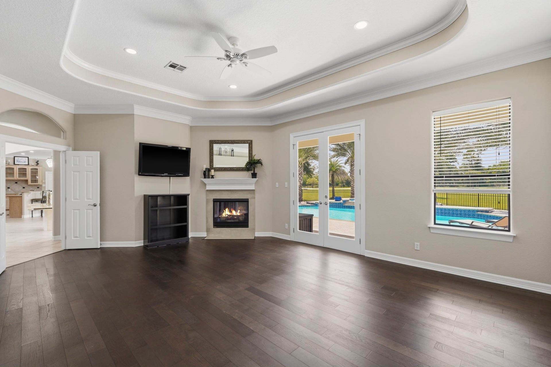 835 Hall Road, Alvin, TX 77511 Primary bedroom features fireplace and French doors to the outdoors