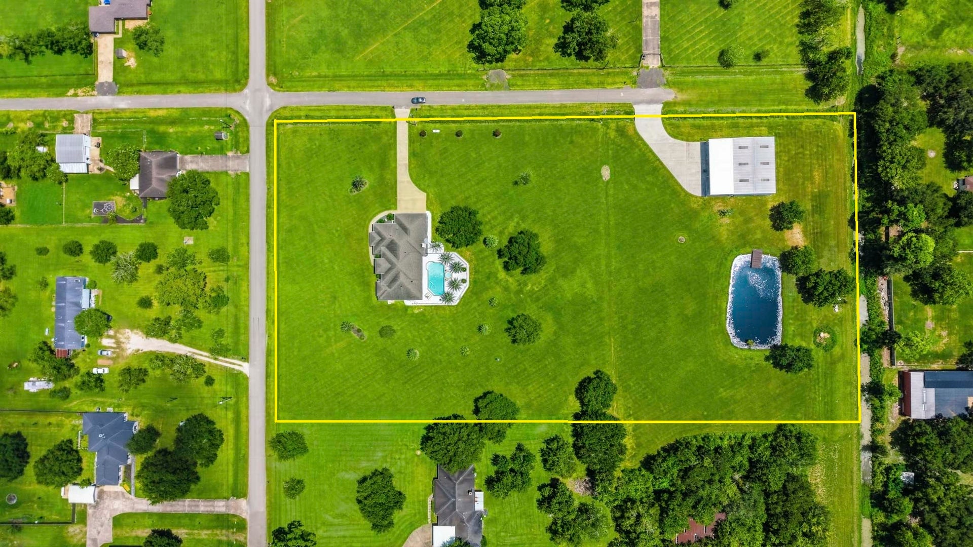 835 Hall Road, Alvin, TX 77511 Top-down aerial showcasing the full property layout and surrounding area
