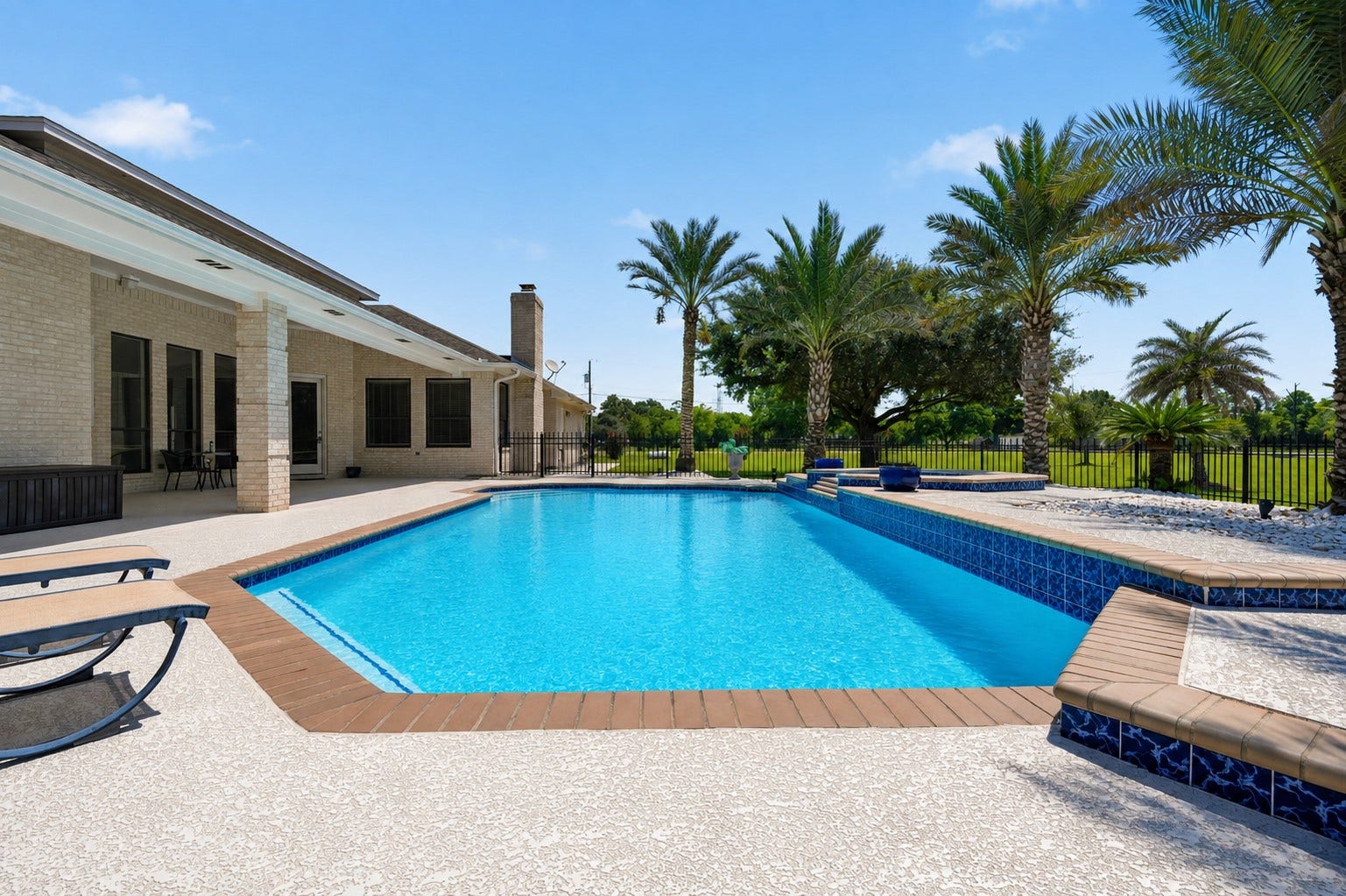 835 Hall Road, Alvin, TX 77511 Sparkling pool and spa with generous surrounding patio space