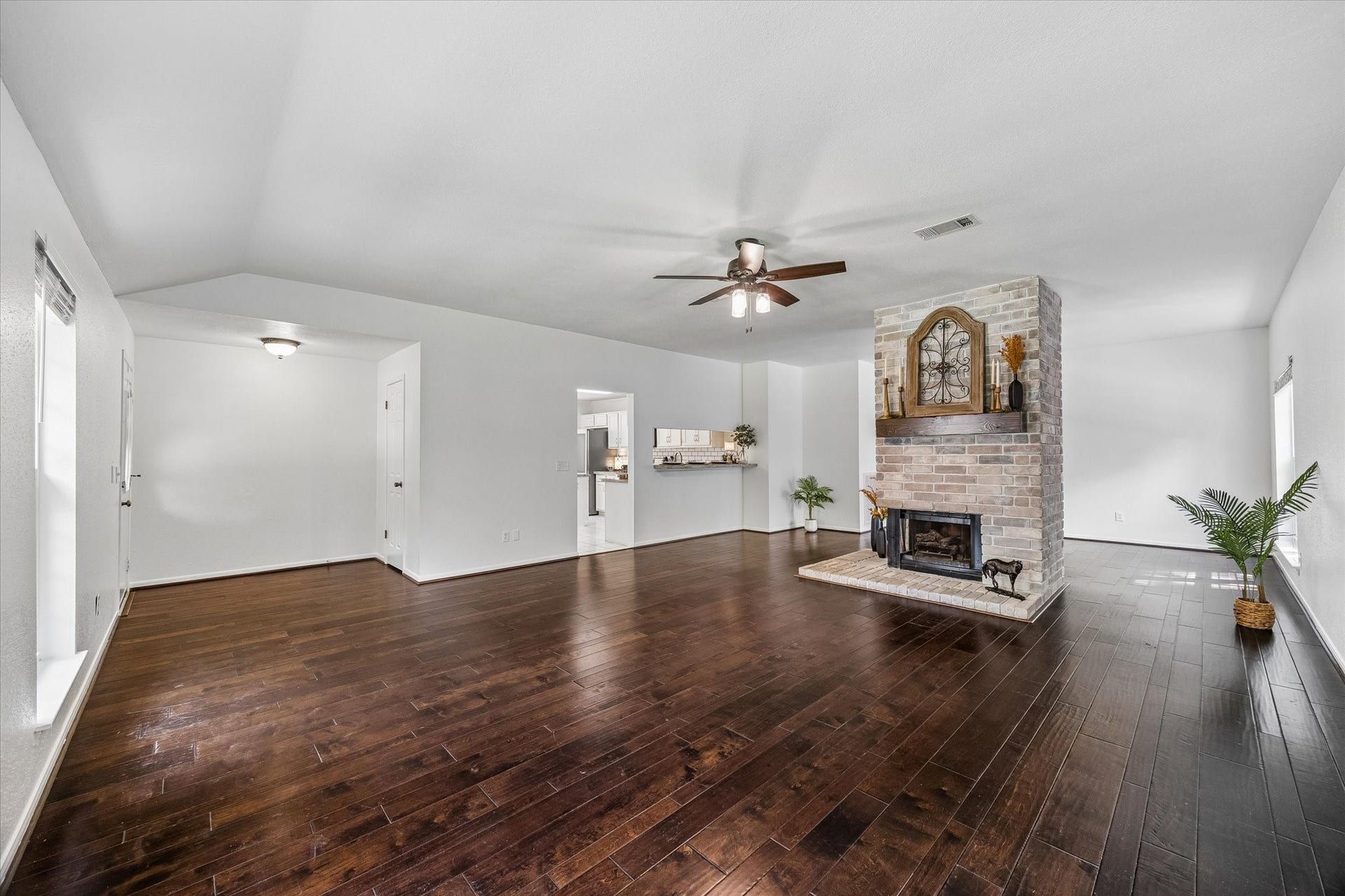 6 Cottage Grove Place, The Woodlands, TX 77381 Another view of the family room looking towards the front door in the back left corner and the kitchen straight ahead.