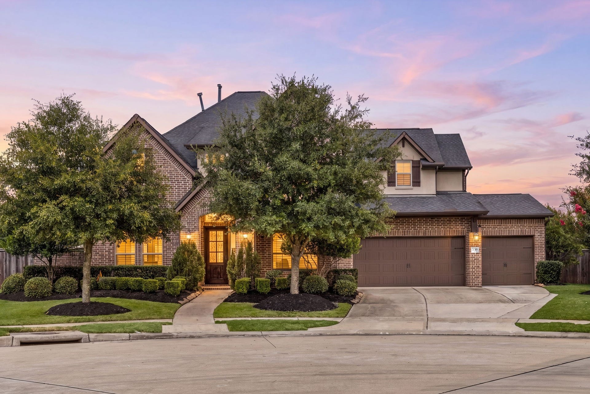 7046 N Savannah Run, Katy, TX 77493 Stunning brick and stone elevation with timeless curb appeal.