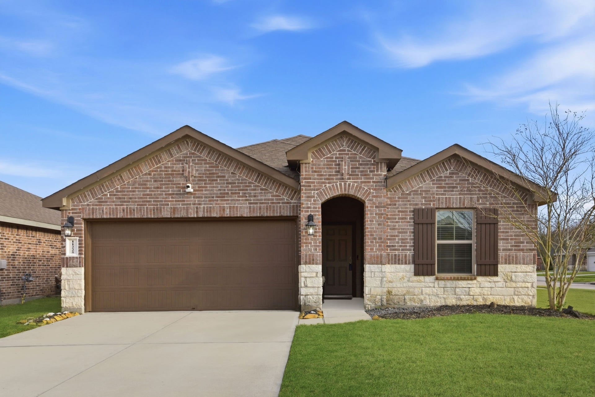 11225 34th Avenue N, Texas City, TX 77591 Spacious double-wide driveway with attached 2-car garage in desirable subdivision.